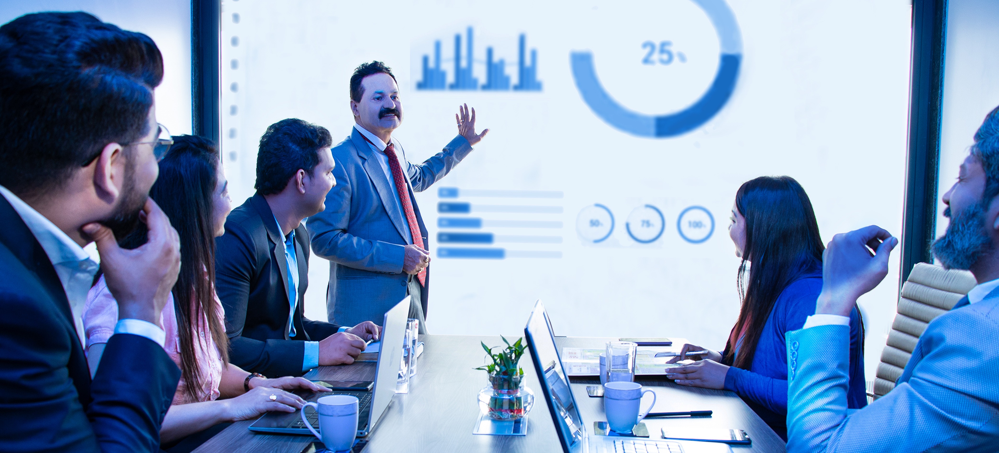 [Featured Image]: A product marketing professional shares insights about the target market for a new product during a team meeting about a product launch.
