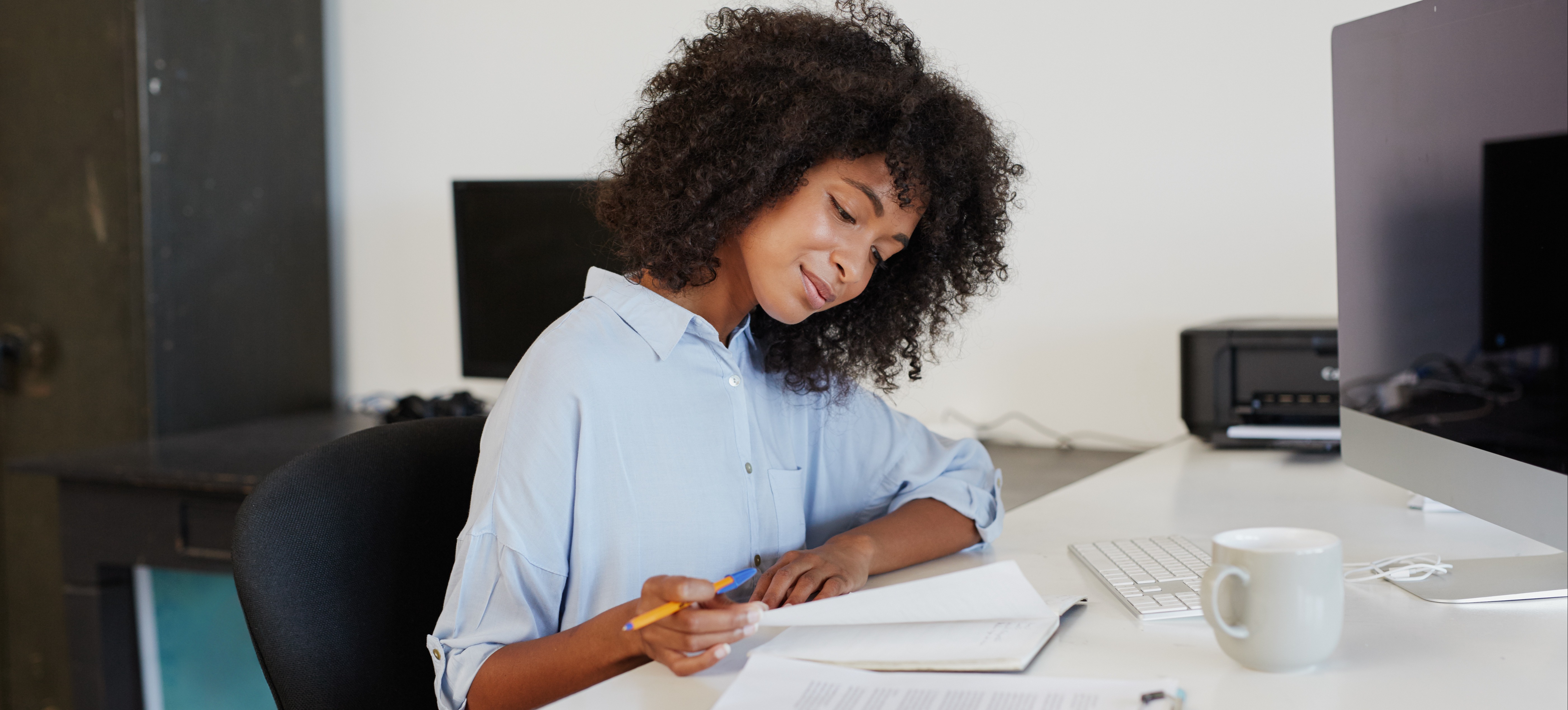 [Featured image] A person adds an education section to their resume.