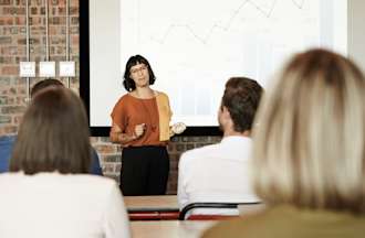 Data scientist presents her findings in a meeting