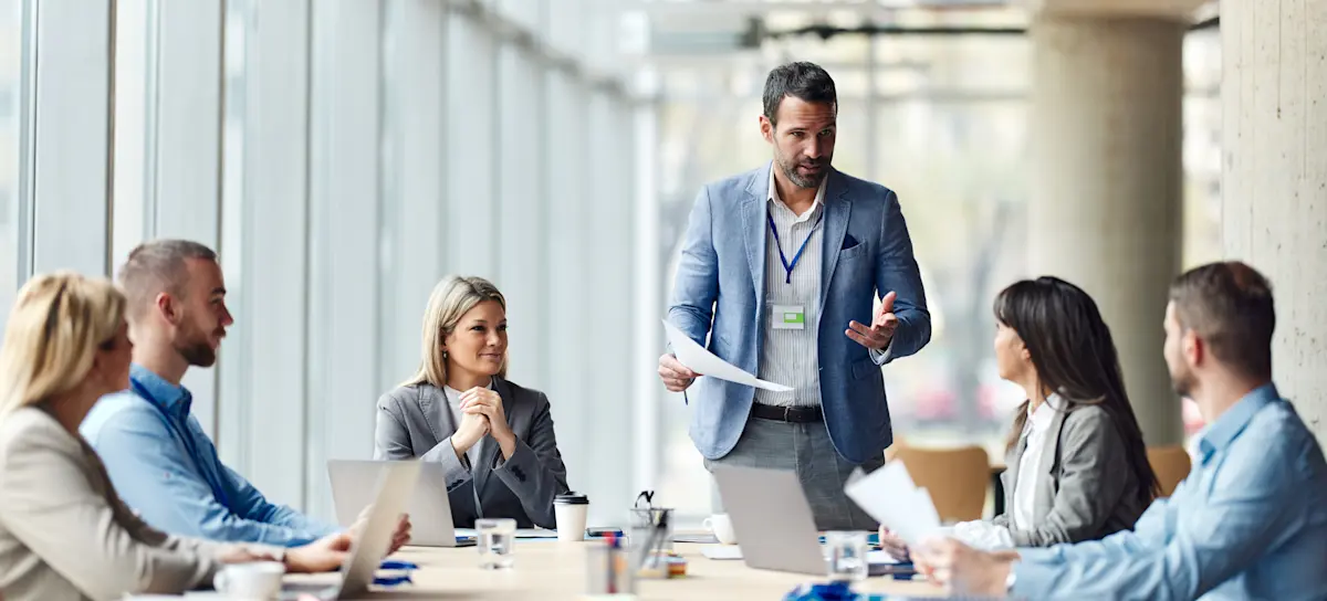 [Featured image] CEO discussing performance metrics with their team in an office.