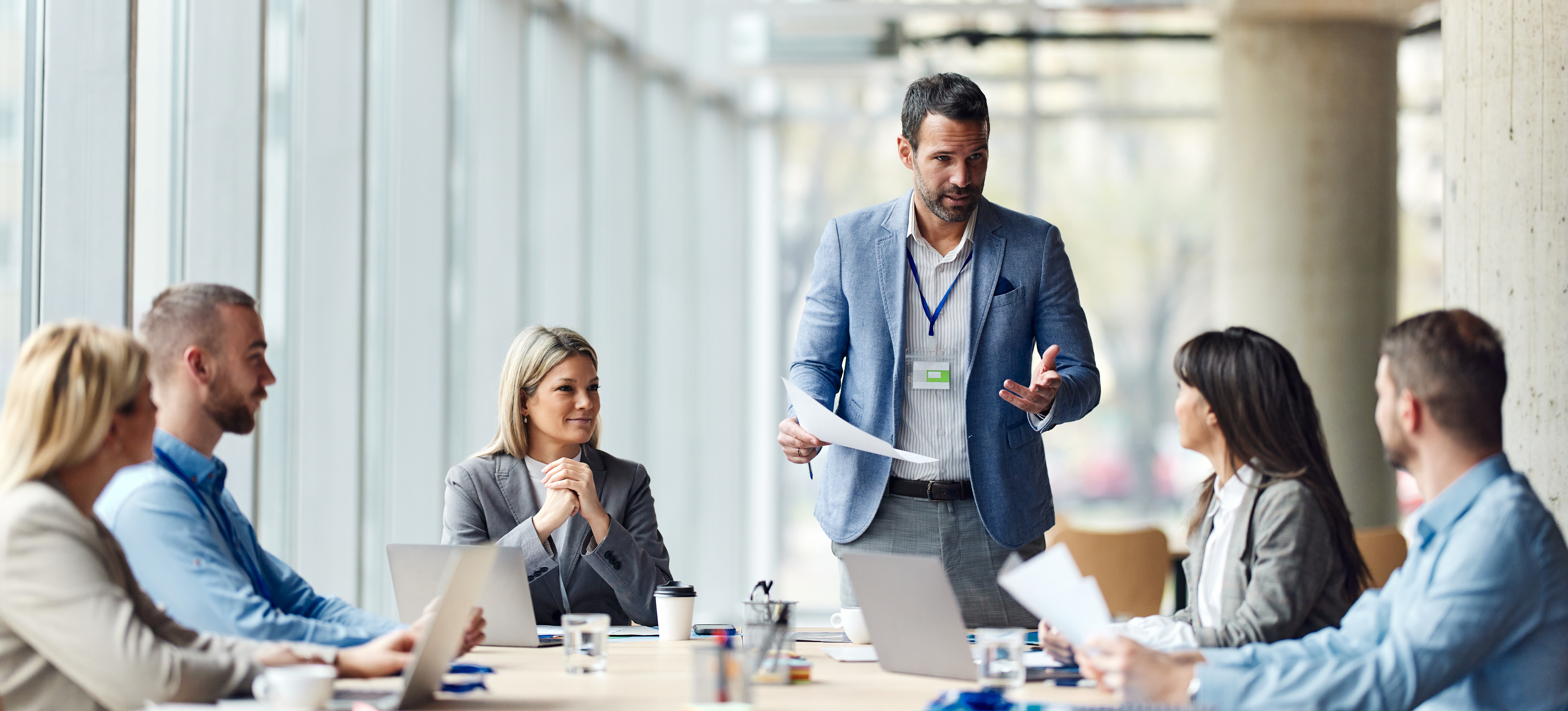 [Featured image] CEO discussing performance metrics with their team in an office.