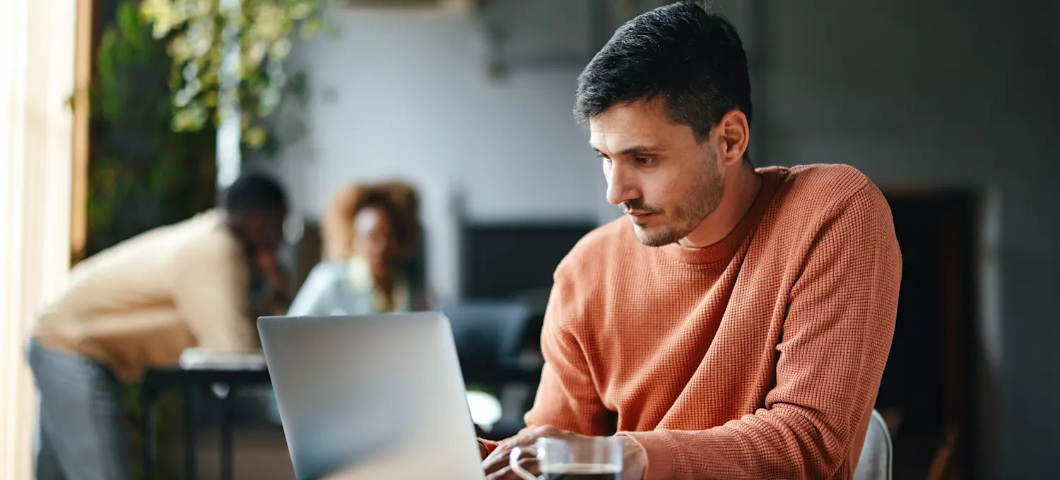 [Featured image] Person studies on their laptop for a data architect certification.
