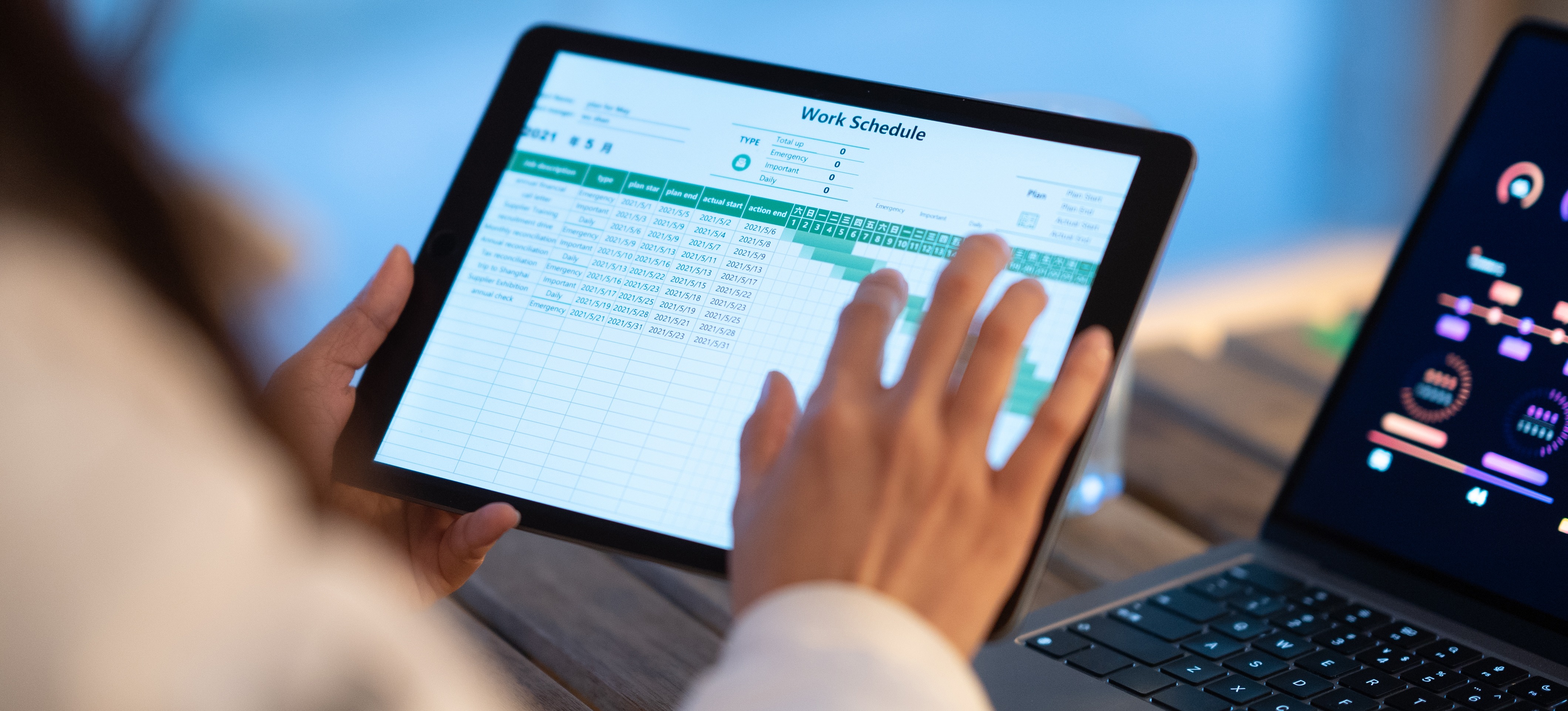 [Featured image] A project manager builds a work schedule for a statement of work (SOW) on a tablet.