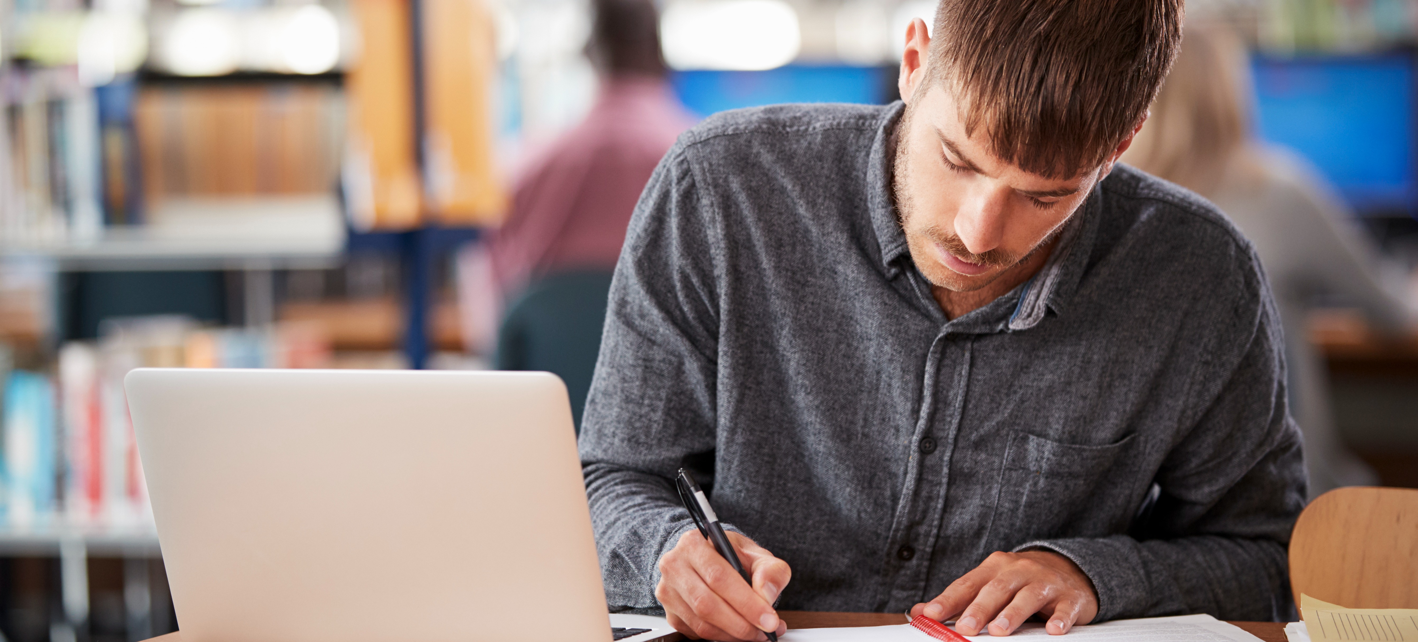 [Feature Image] A learner researches Master of Data Science salary figures on their laptop as they plan their educational pathway. 
