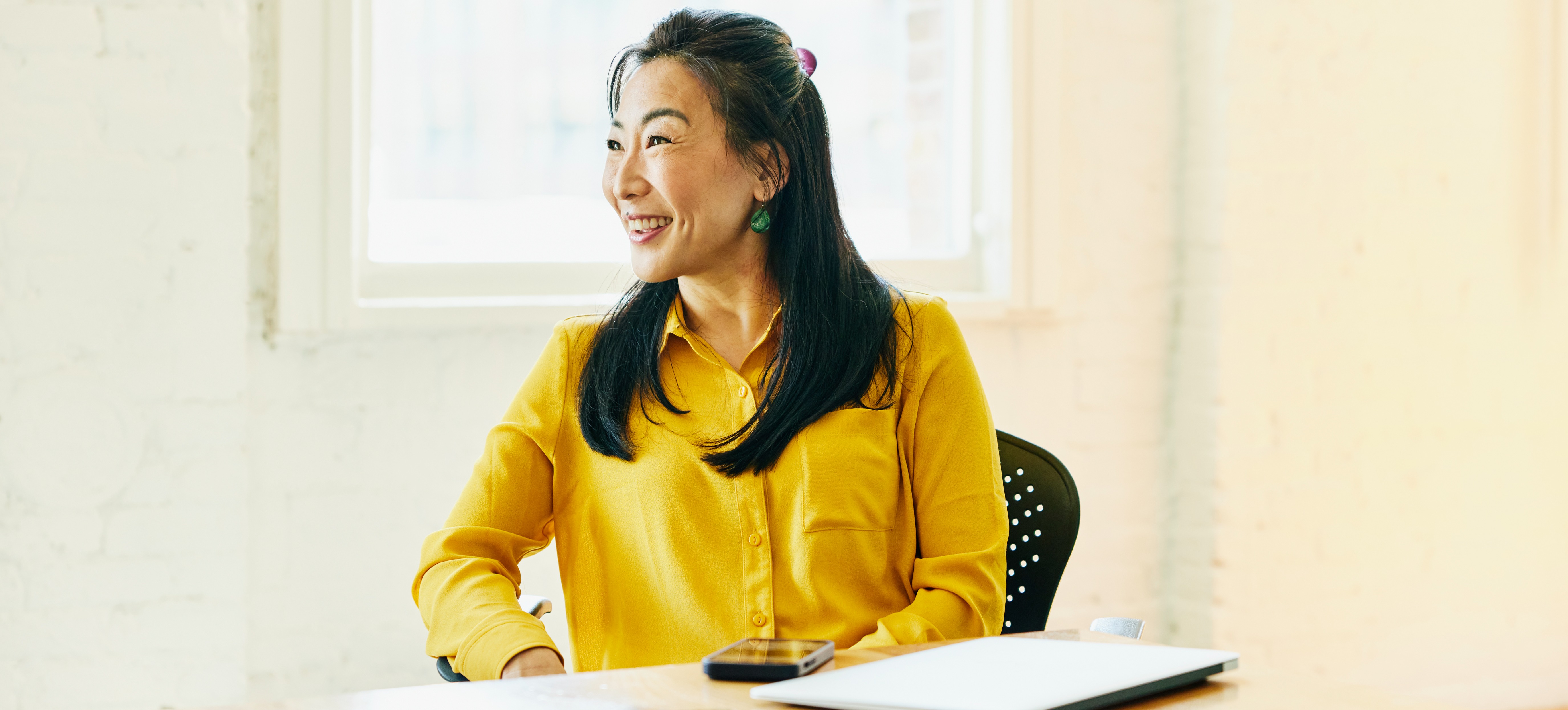 [Featured image] A woman is working on her accountant resume for her new accounting job.