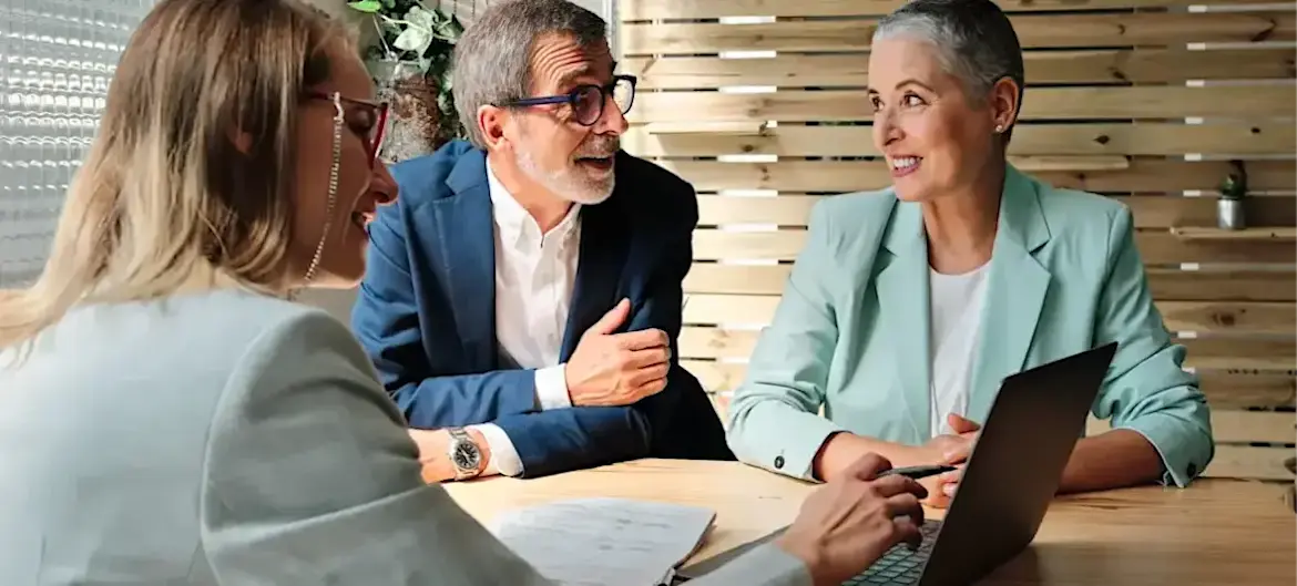 [Featured Image] Three colleagues discuss the accounting certifications they each intend to pursue to advance their careers.