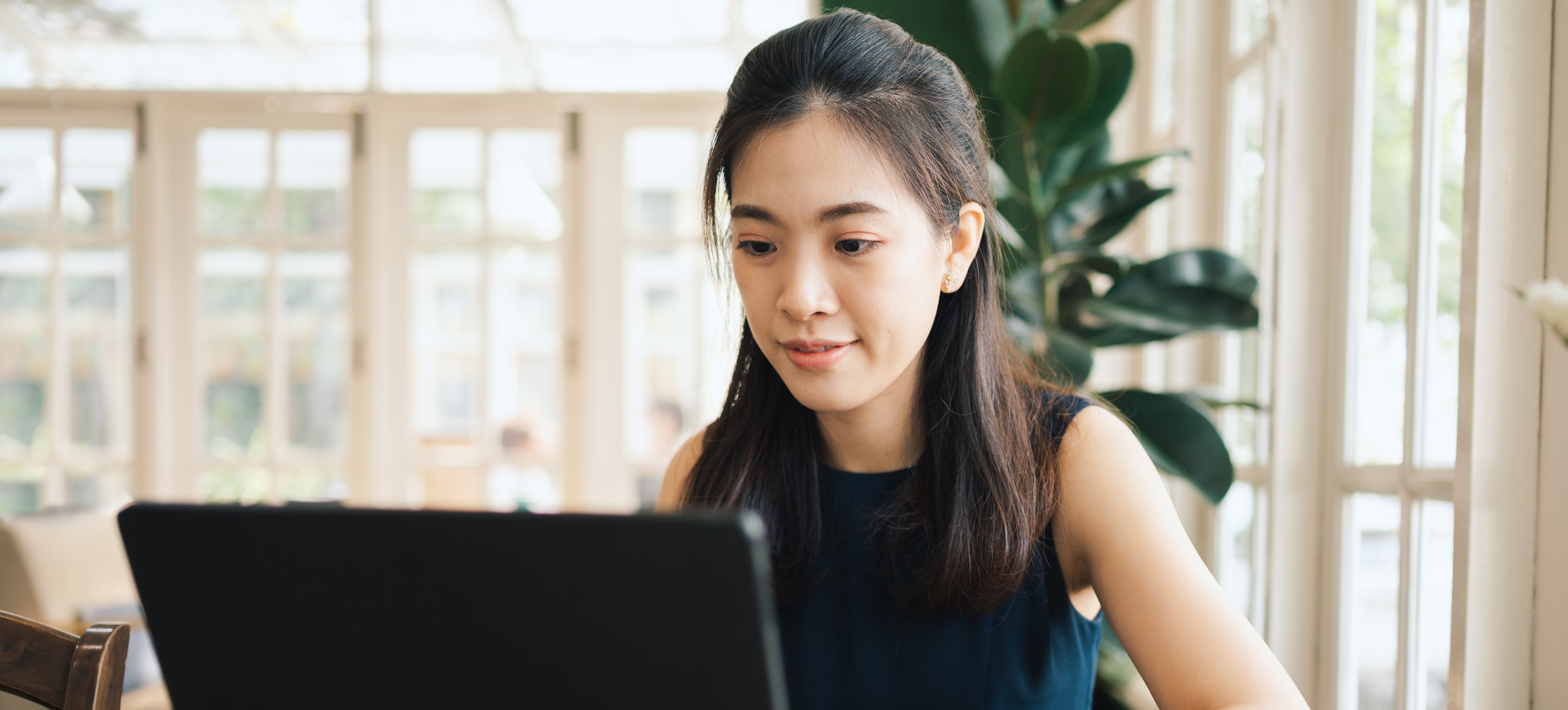 [Featured Image] A person researches the differences between generative AI and large language models.
