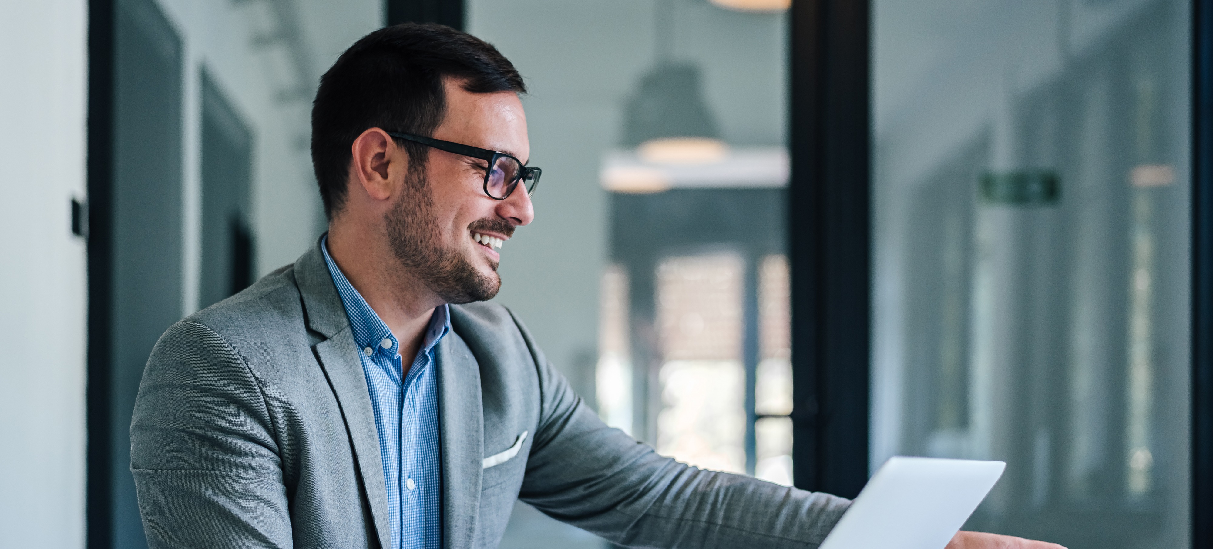 [Featured Image] A startup founder works on defining the company’s organizational purpose after researching “What is a mission statement?”
