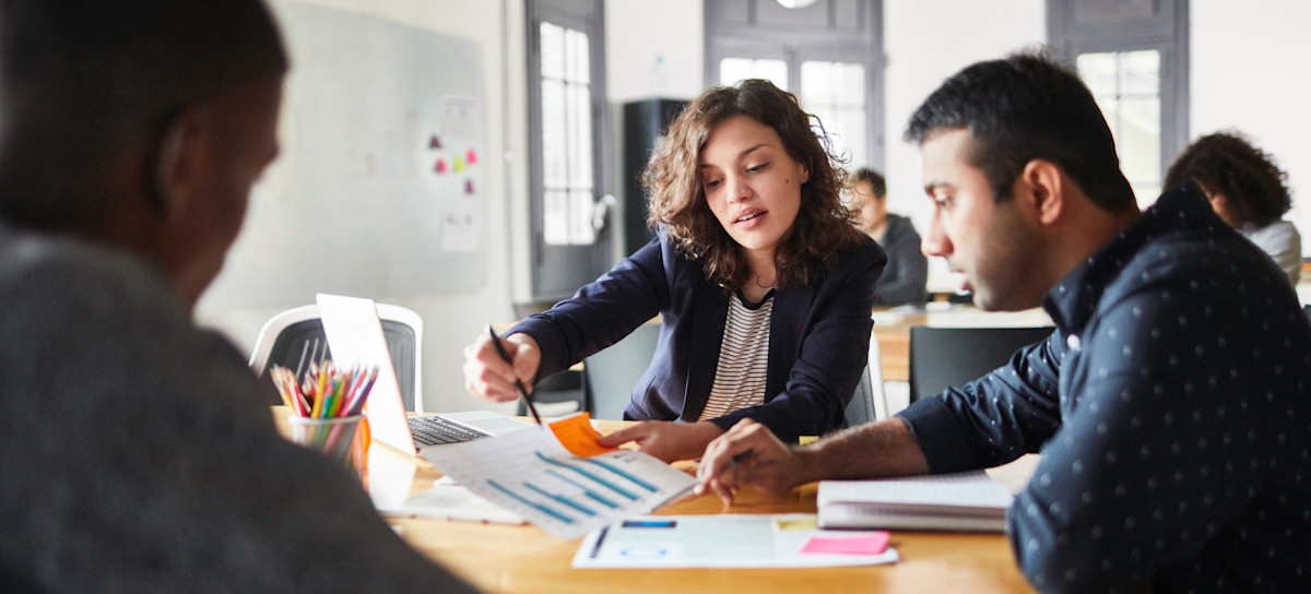 [Featured image] A marketing analyst gives a presentation to their business team on their findings