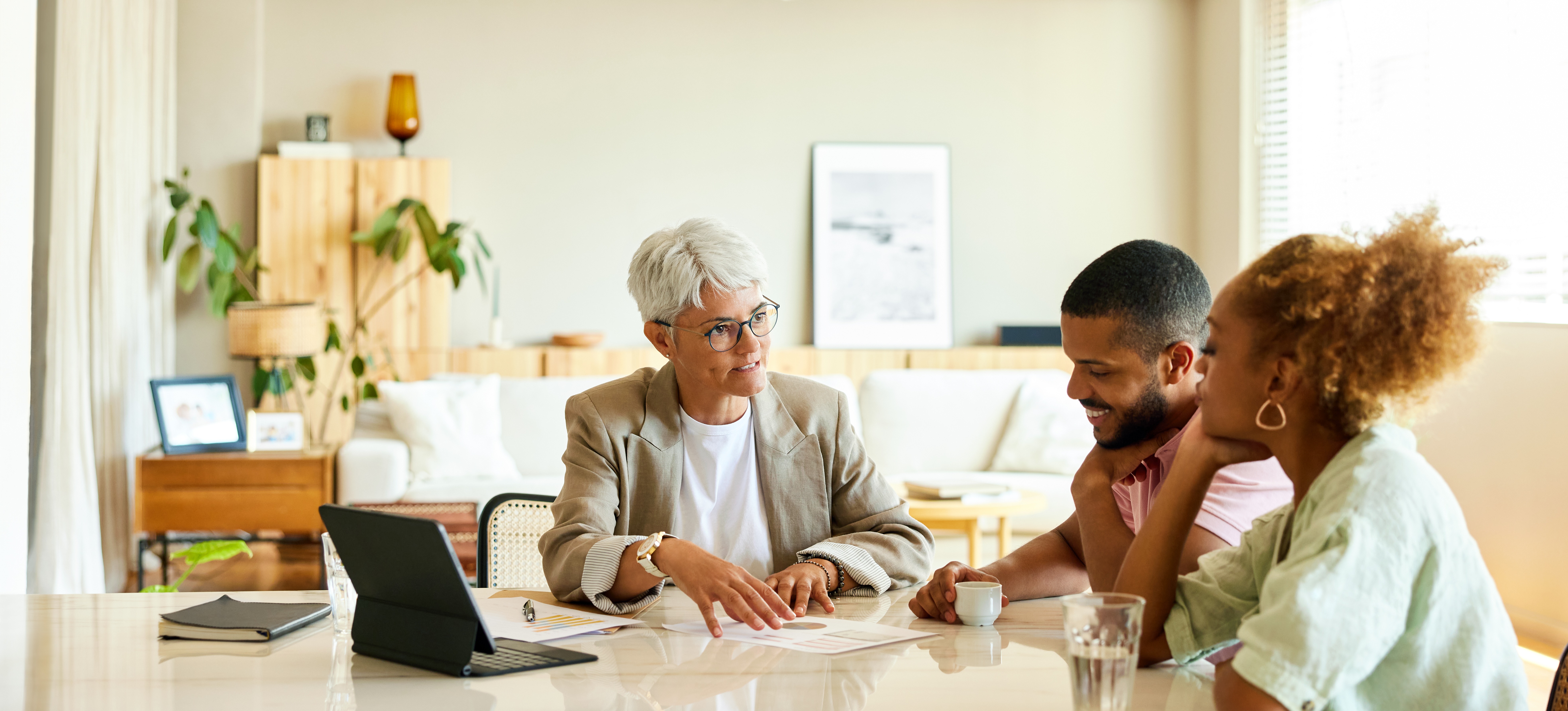 [Feature Image] A CPA discusses important accounting strategies with two clients. 
