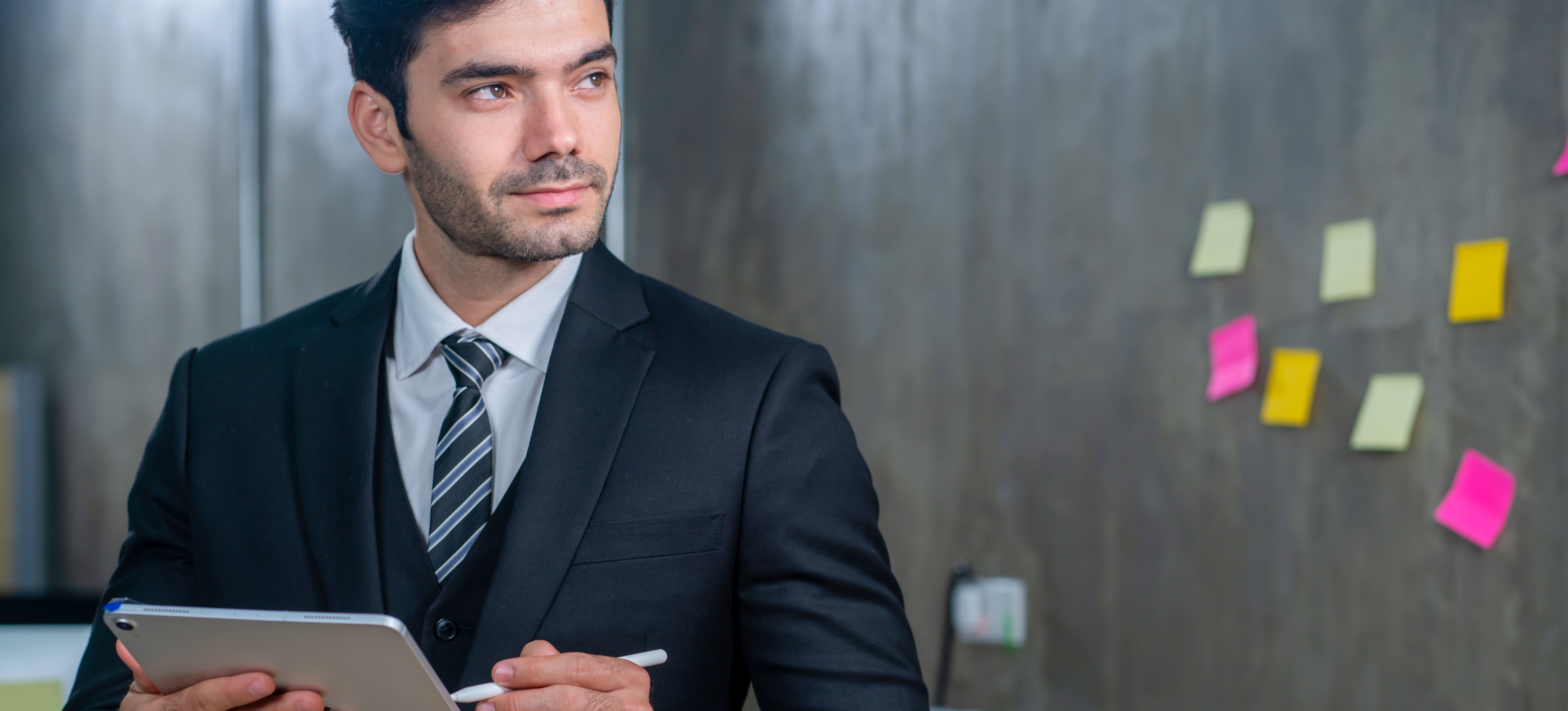 [Featured Image] A sports manager prepares for a client meeting.
