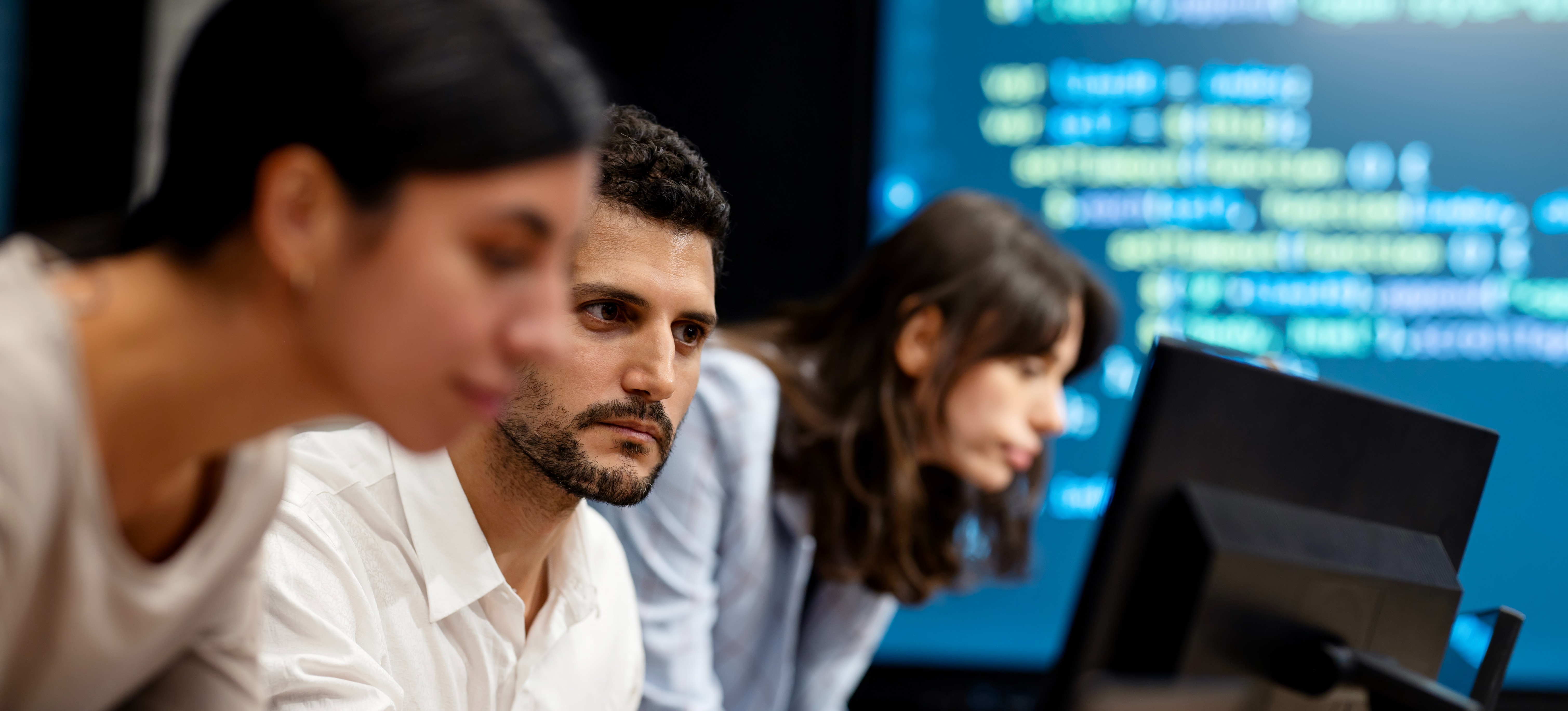 [Featured Image] Professionals on a prompt engineering career path first-line test AI interactions on a project. 
