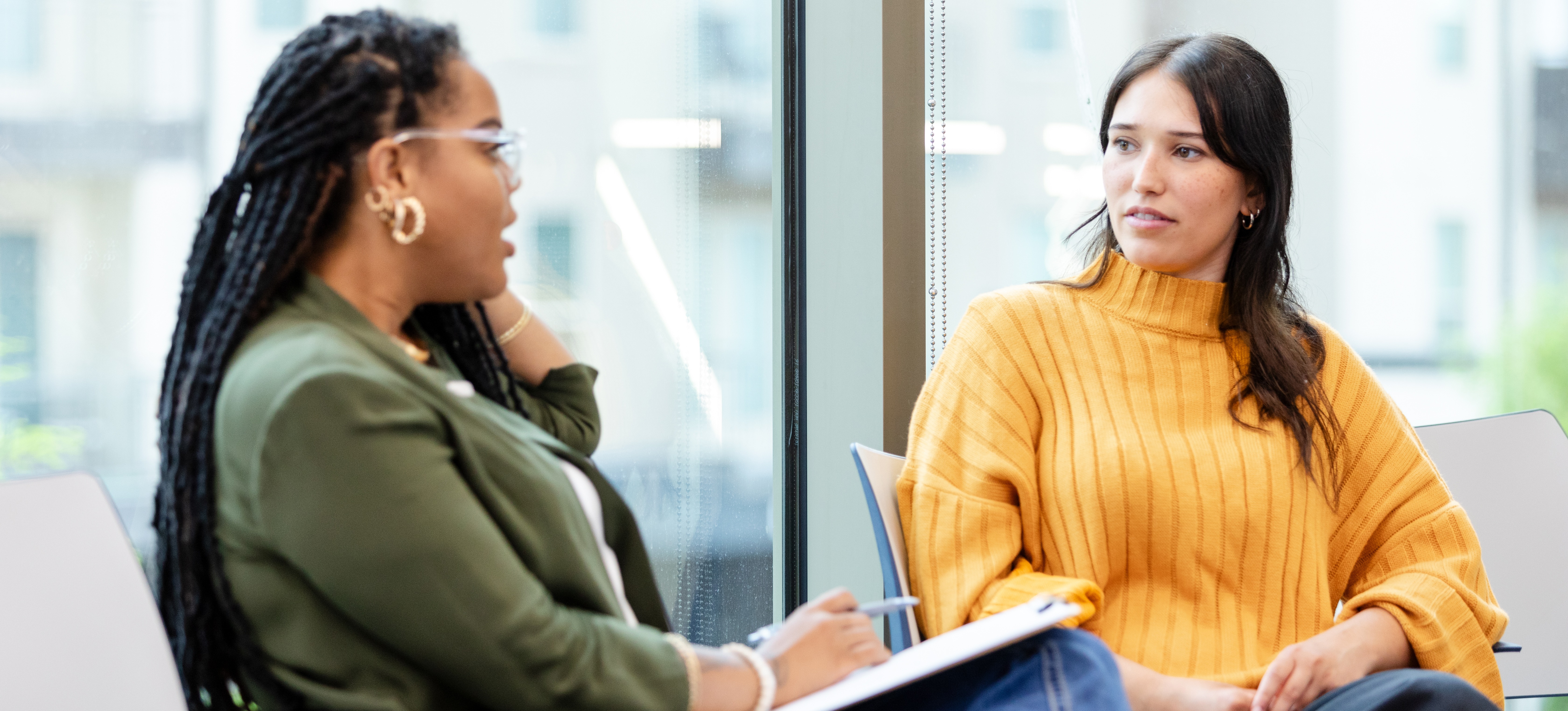 [Featured Image] A college counselor sits with a student in an office while the student asks "what is honours degree?"
