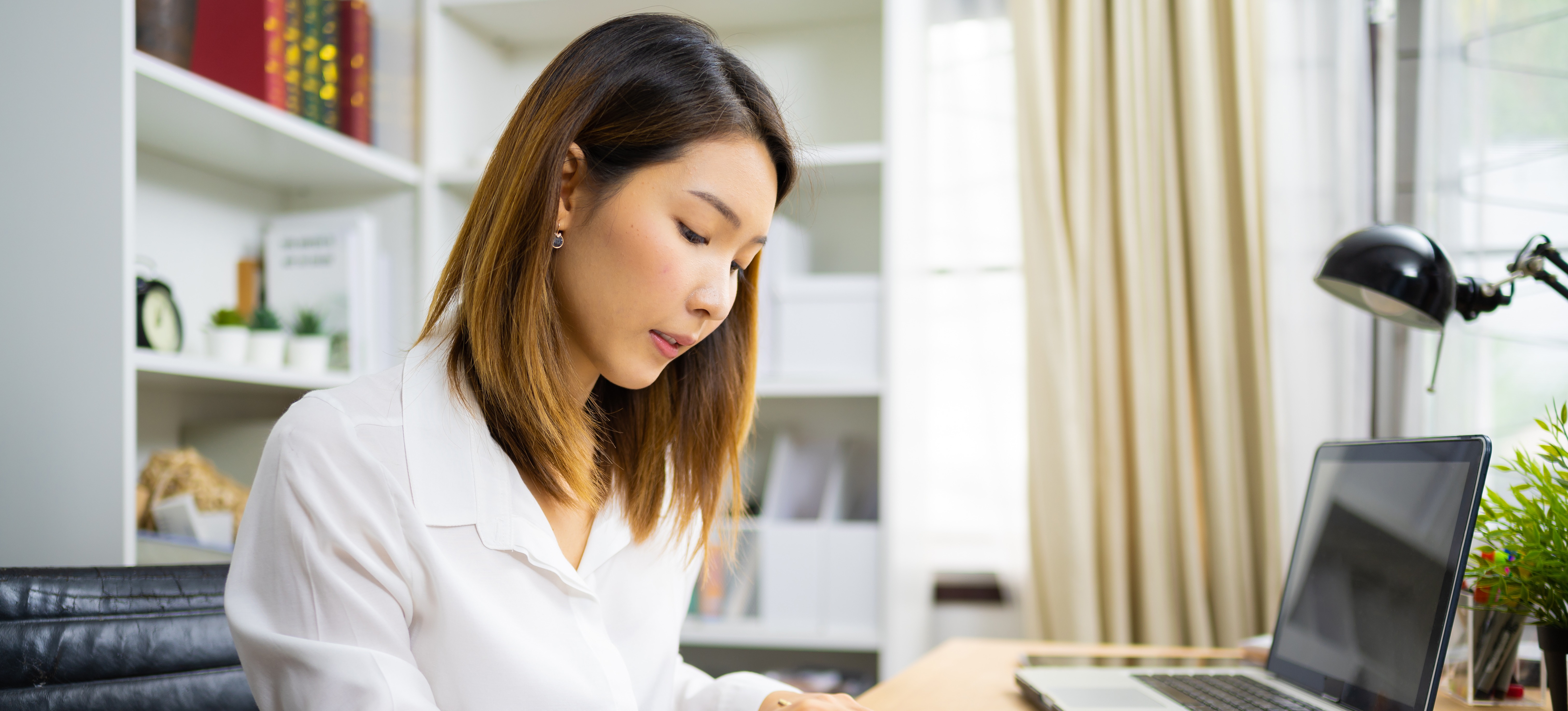[Featured image] An accounting clerk is updating her resume to make it more competitive and appealing to prospective clients.
