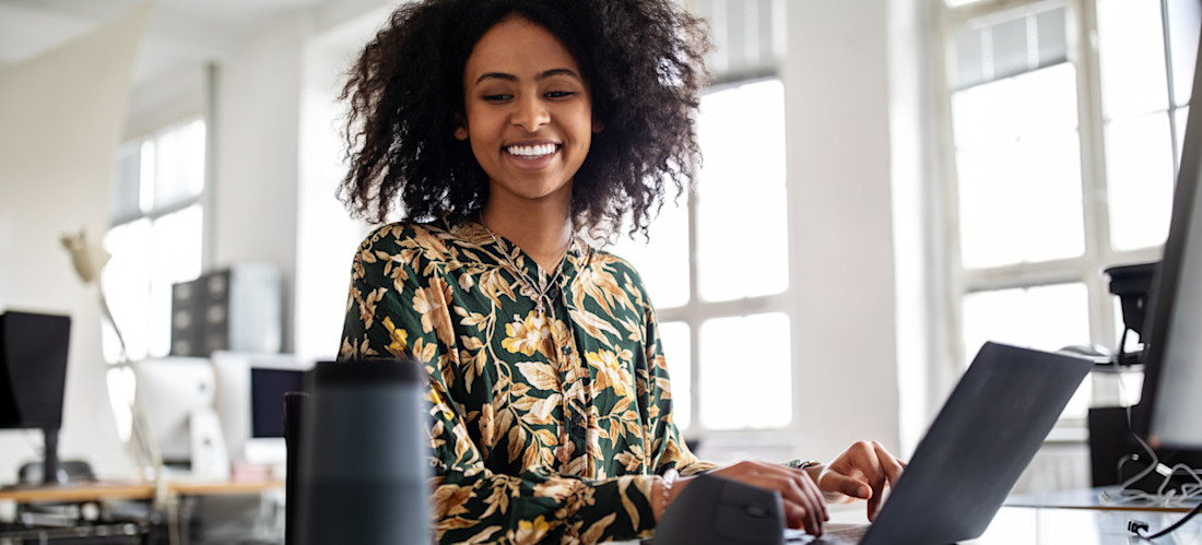 [Feature Image] An aspiring AI engineer researches artificial intelligence salary information on a laptop as they plan their career path.
