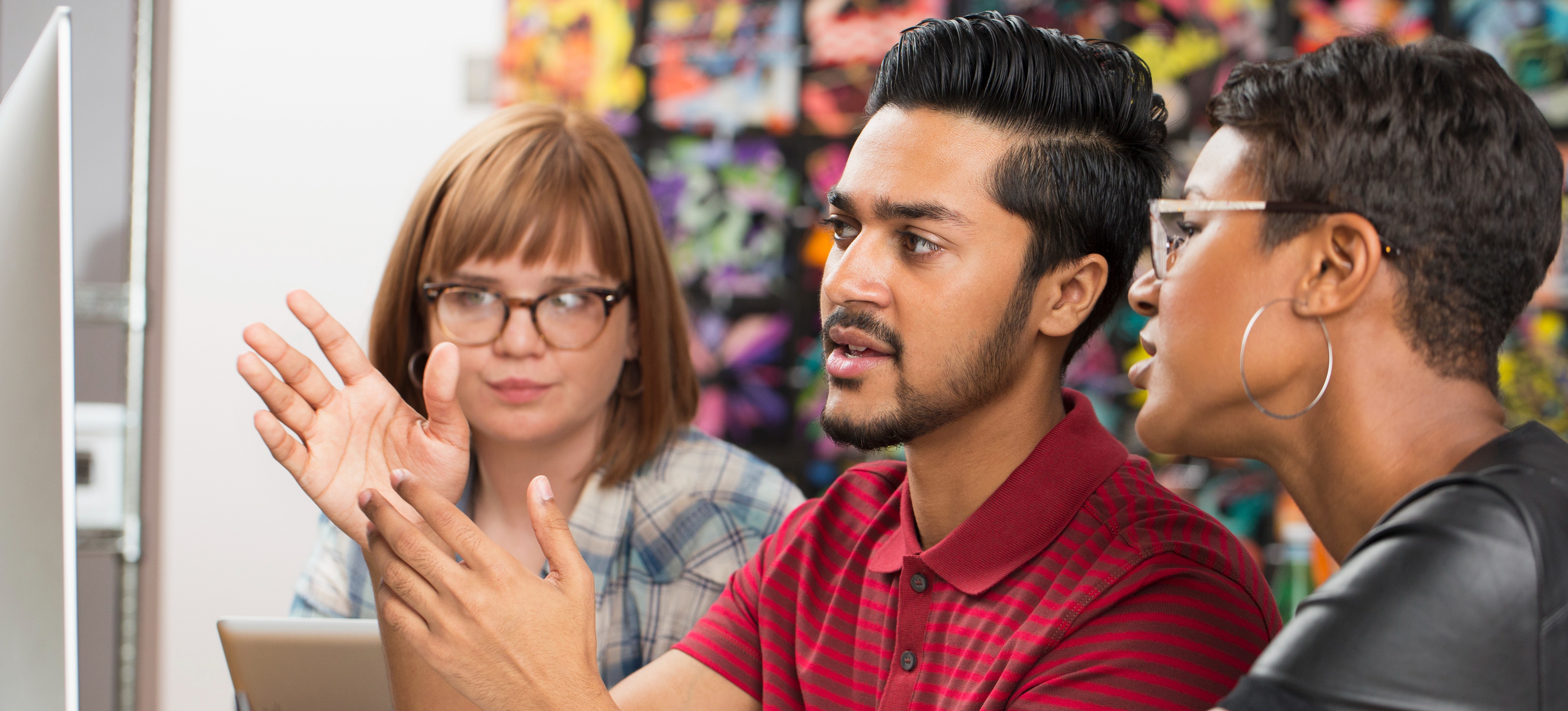 [Featured image] A team of machine learning engineers in an office discussing what is bias in machine learning.