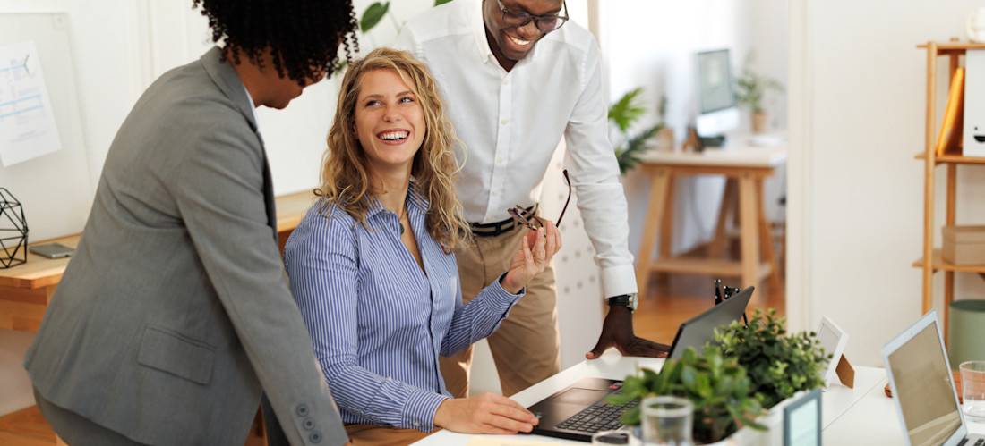 [Featured Image]: A team collaborating in a modern office environment, discussing AI cloud services.
