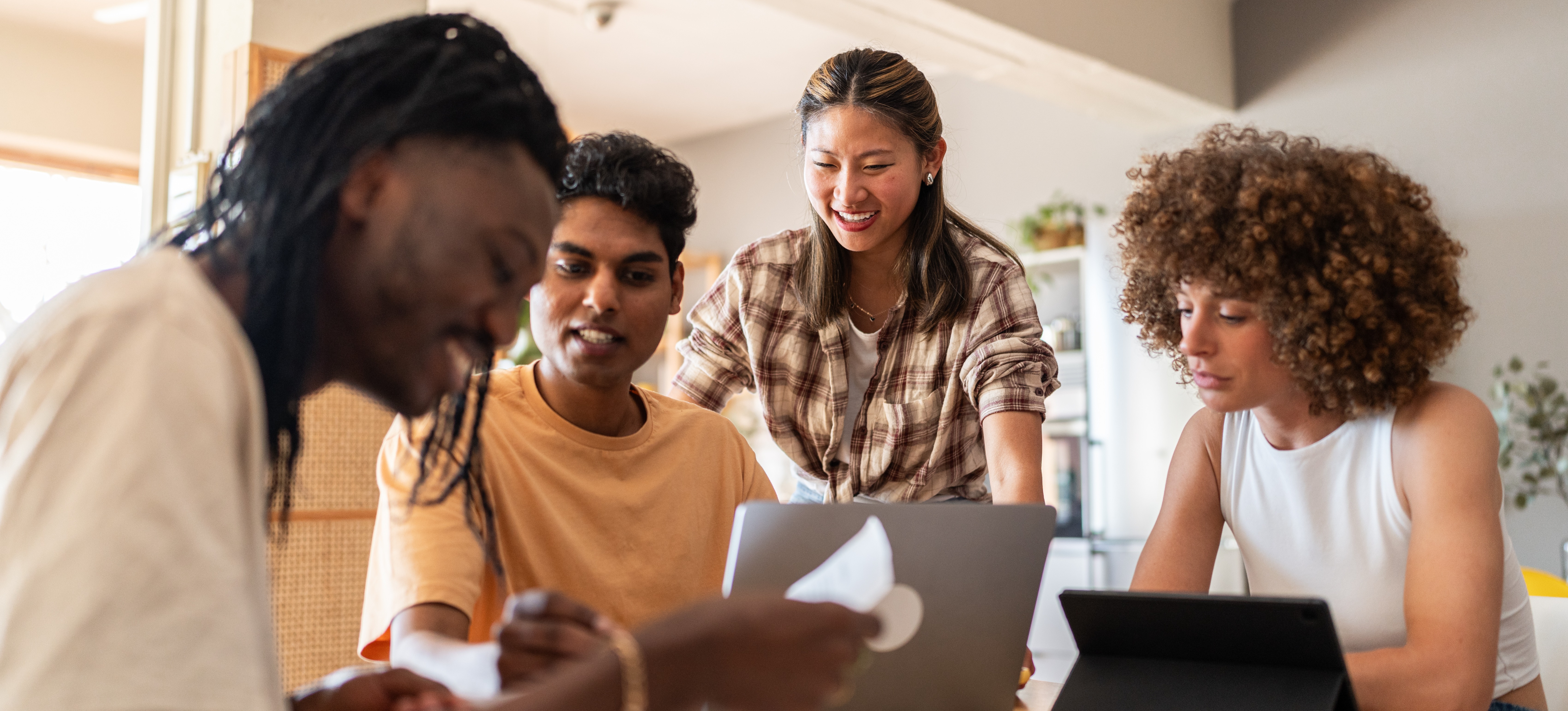[Feature Image] A group of business students study together in a quiet setting as they discuss the question, “Is a business degree worth it?”
