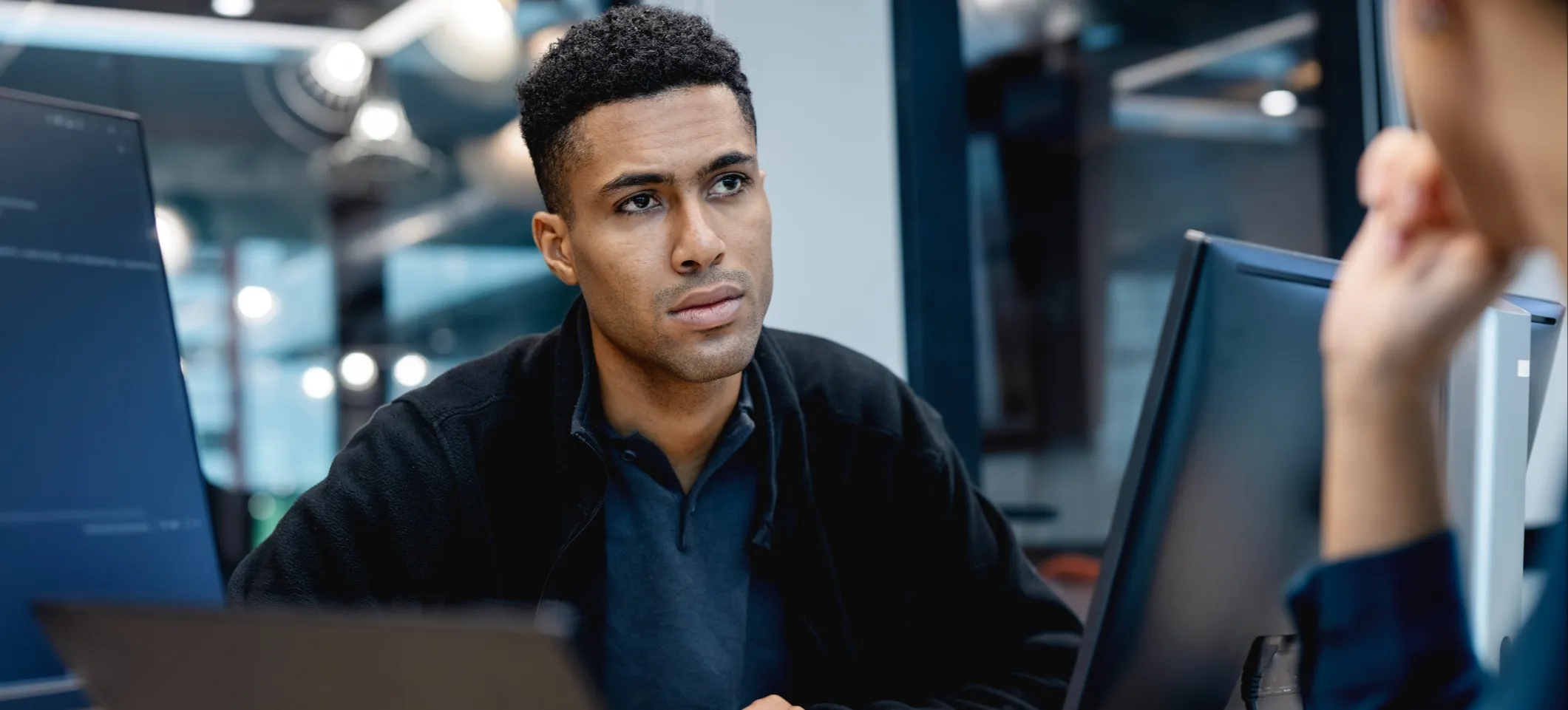 [Featured Image] A young professional meets with their mentor to have various ChatGPT models explained as they explore ways to integrate the technology into their workflows.
