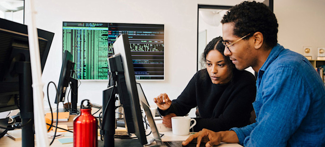 [Featured image] Staff working on data input