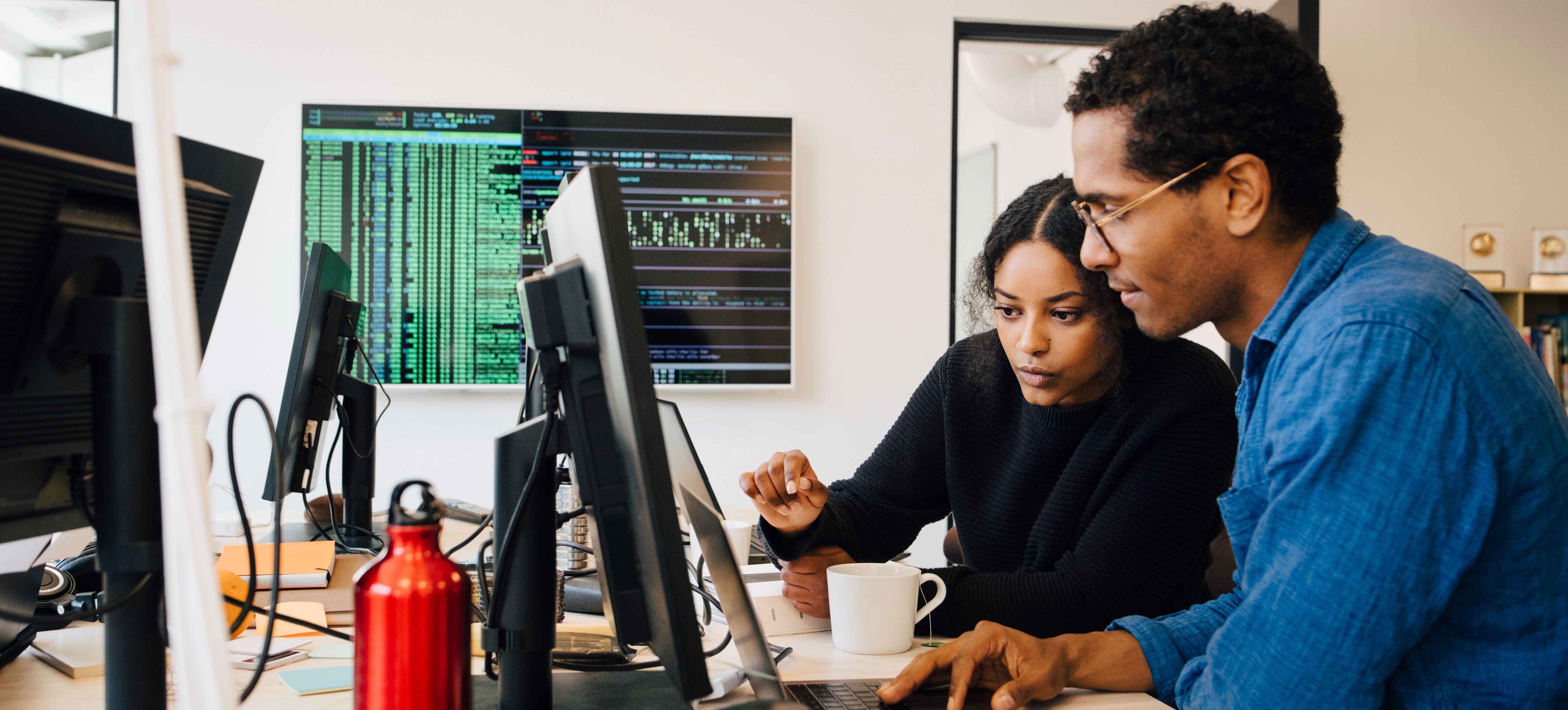 [Featured image] Staff working on data input