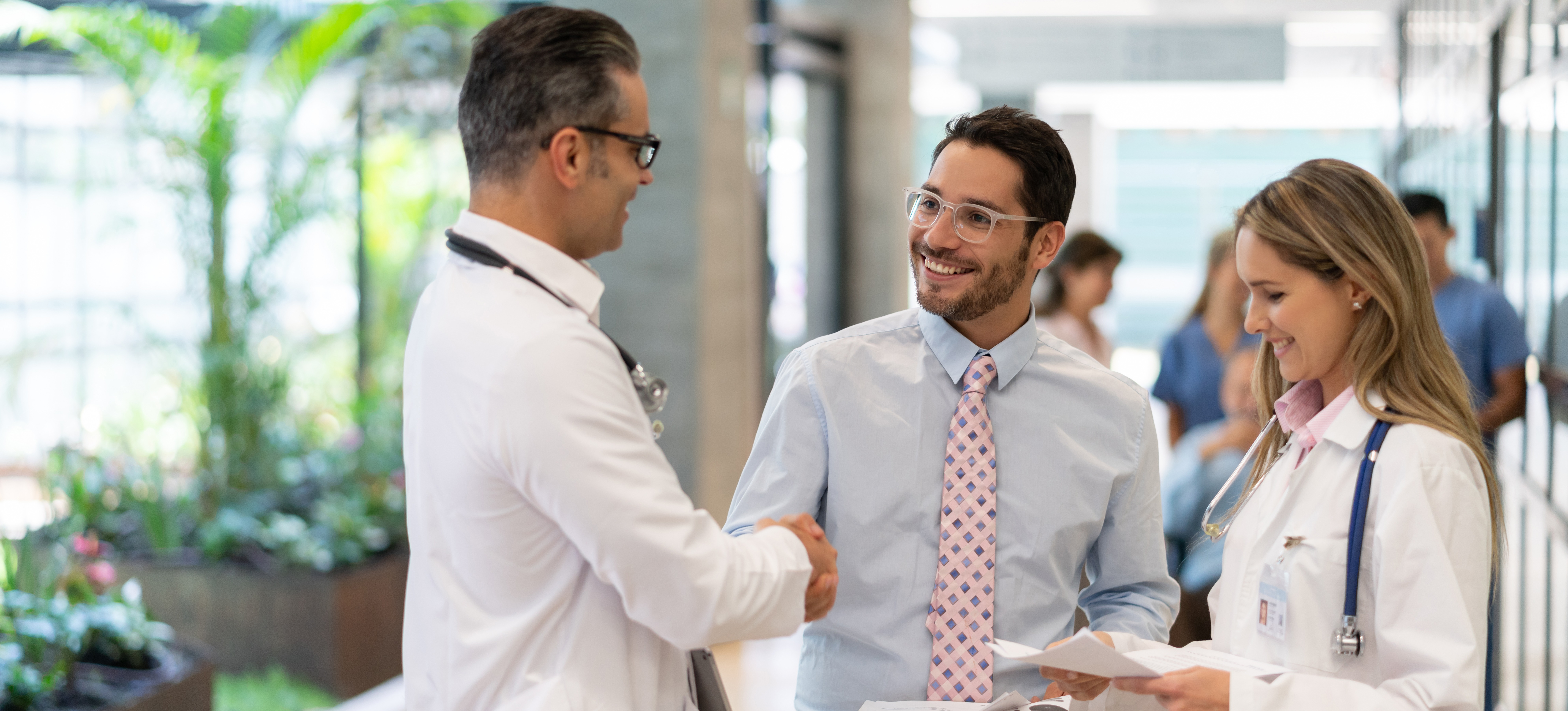 [Feature Image] As health care administration conducts interviews for prospective medical and health services managers, two staff members meet with some of the top candidates.
