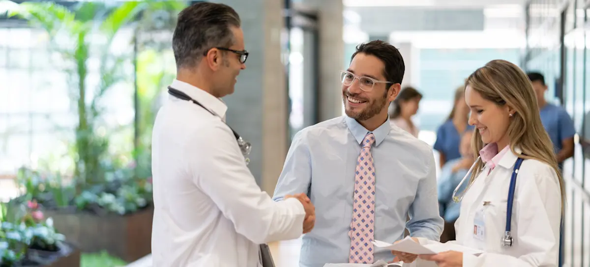 [Feature Image] As health care administration conducts interviews for prospective medical and health services managers, two staff members meet with some of the top candidates.
