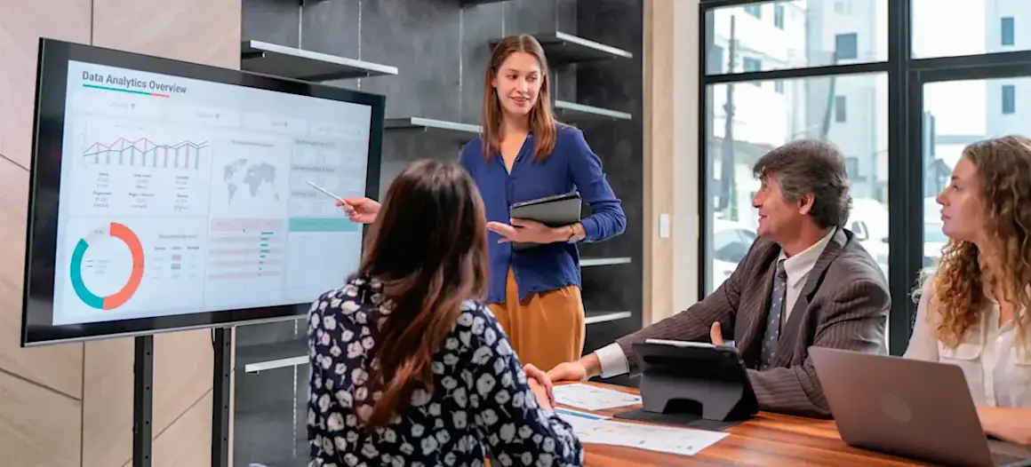 [Featured Image] A business team meets to discuss projected trends in their field through trend analysis data.