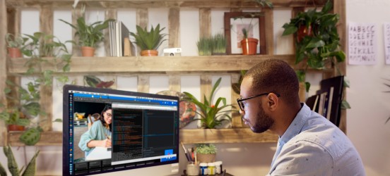 [Featured Image] A WordPress developer works on a website design on their computer.