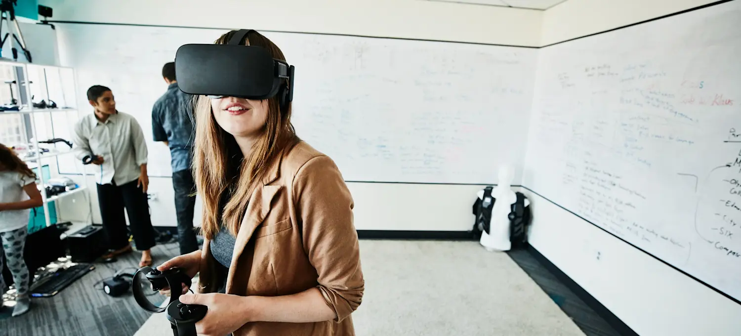 [Featured Image] An engineer tests a new VR content creation project in a VR testing lab.

