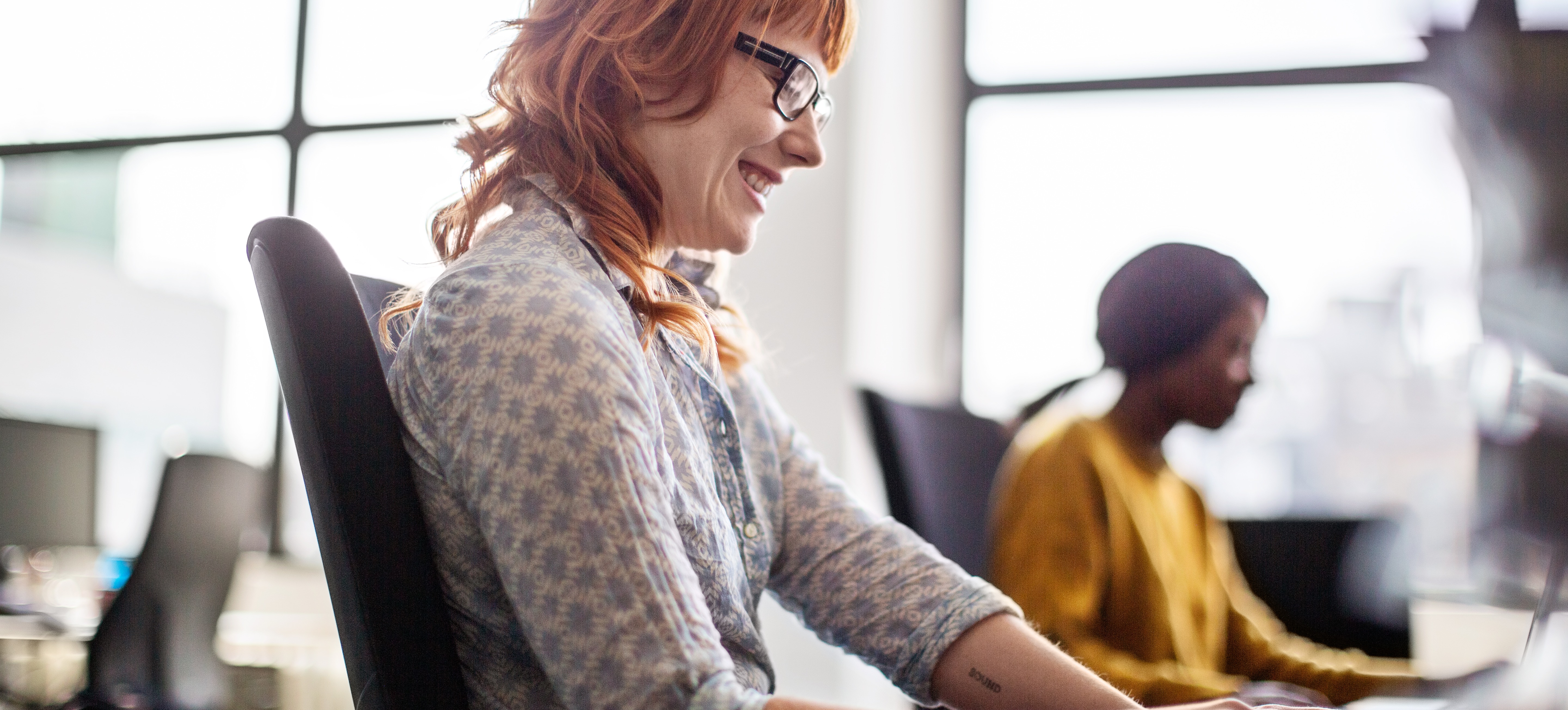 [Featured Image] An AI expert sits at a computer and uses a logic programming language. 
