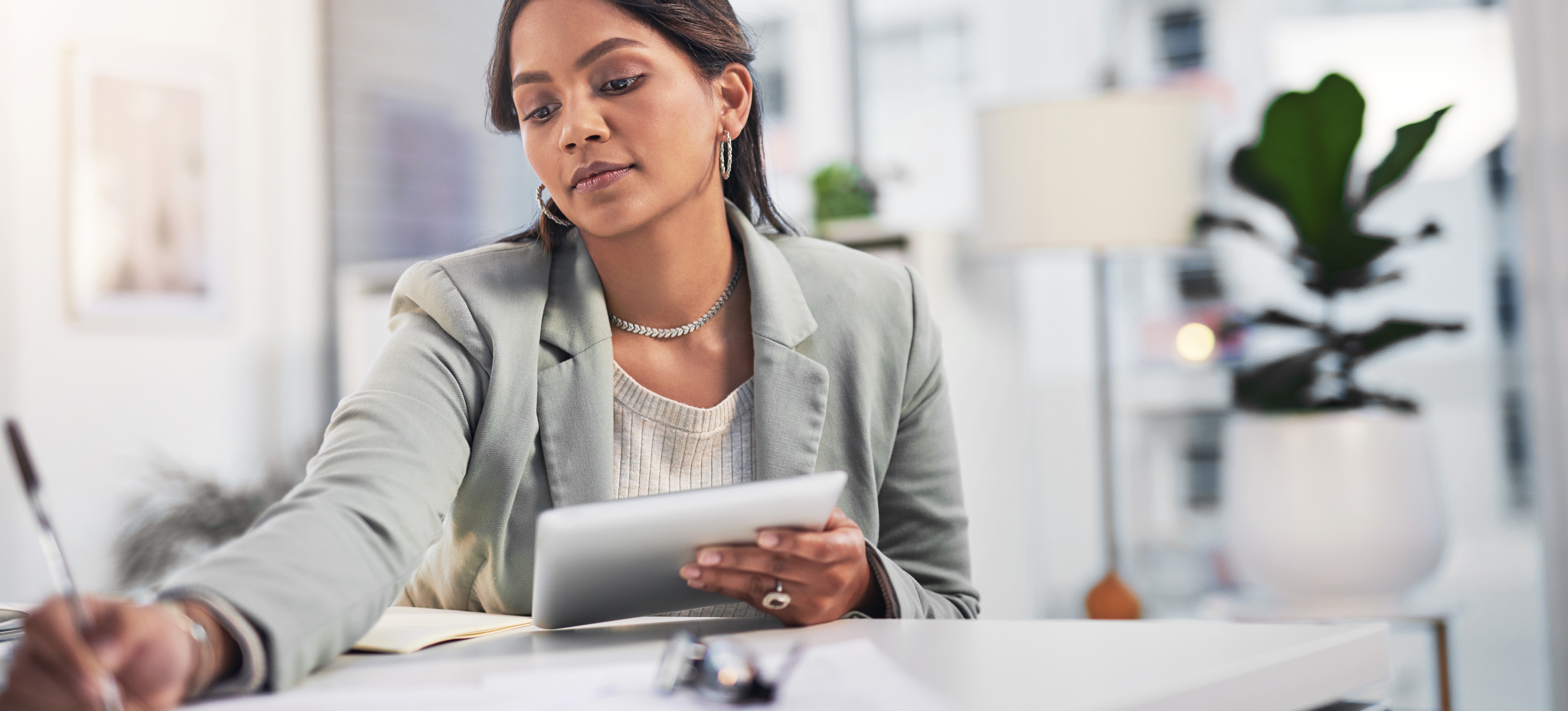 [Featured Image] A quality assurance analyst works at her office desk to conduct smoke testing.
