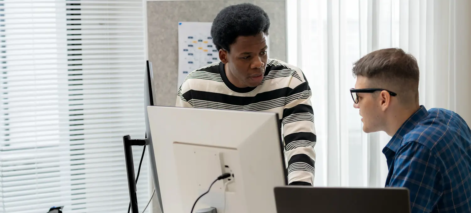 [Feature Image] Two computing professionals discuss CCSP certification as they prepare to pursue the credential. 
