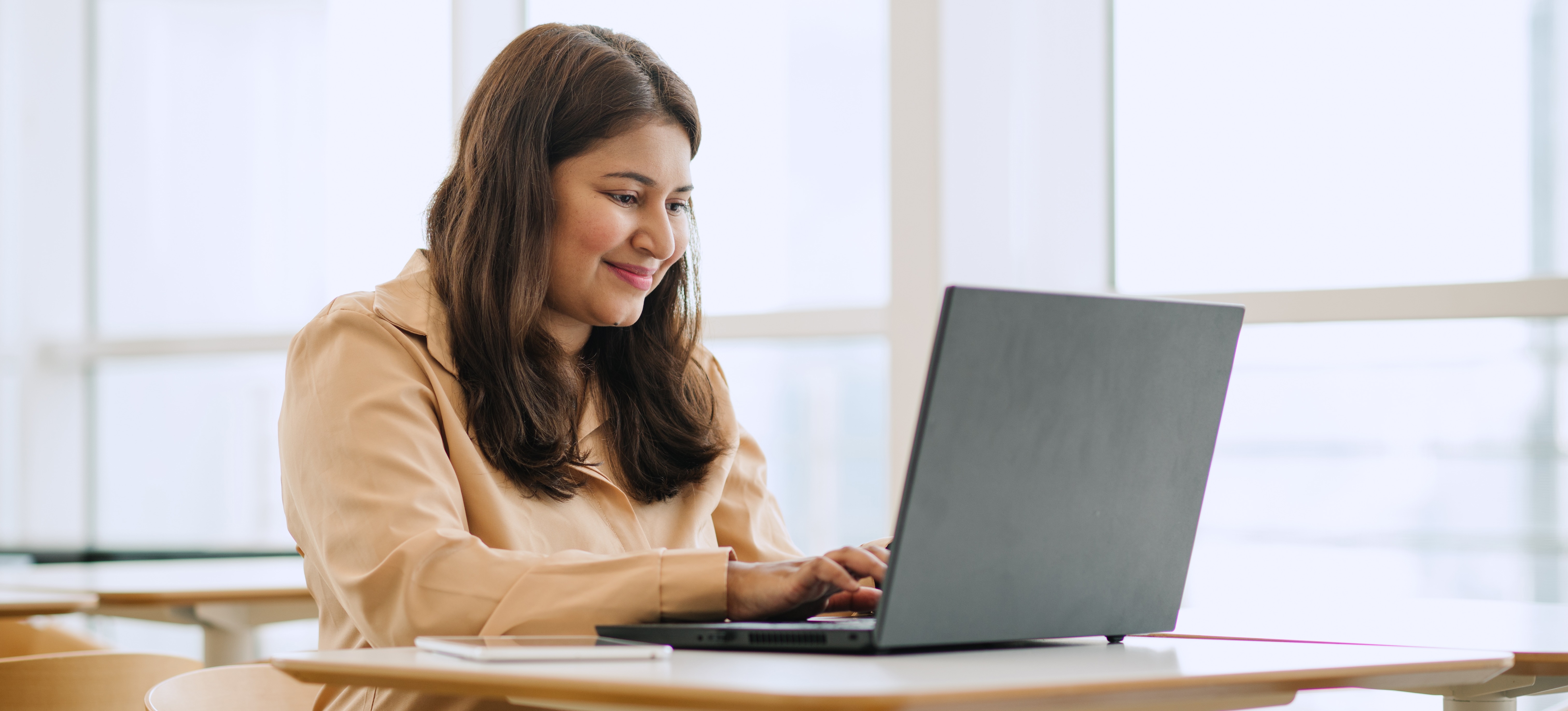[Featured Image] A marketer sits at a laptop and uses SQL commands to look at customers' order history.
