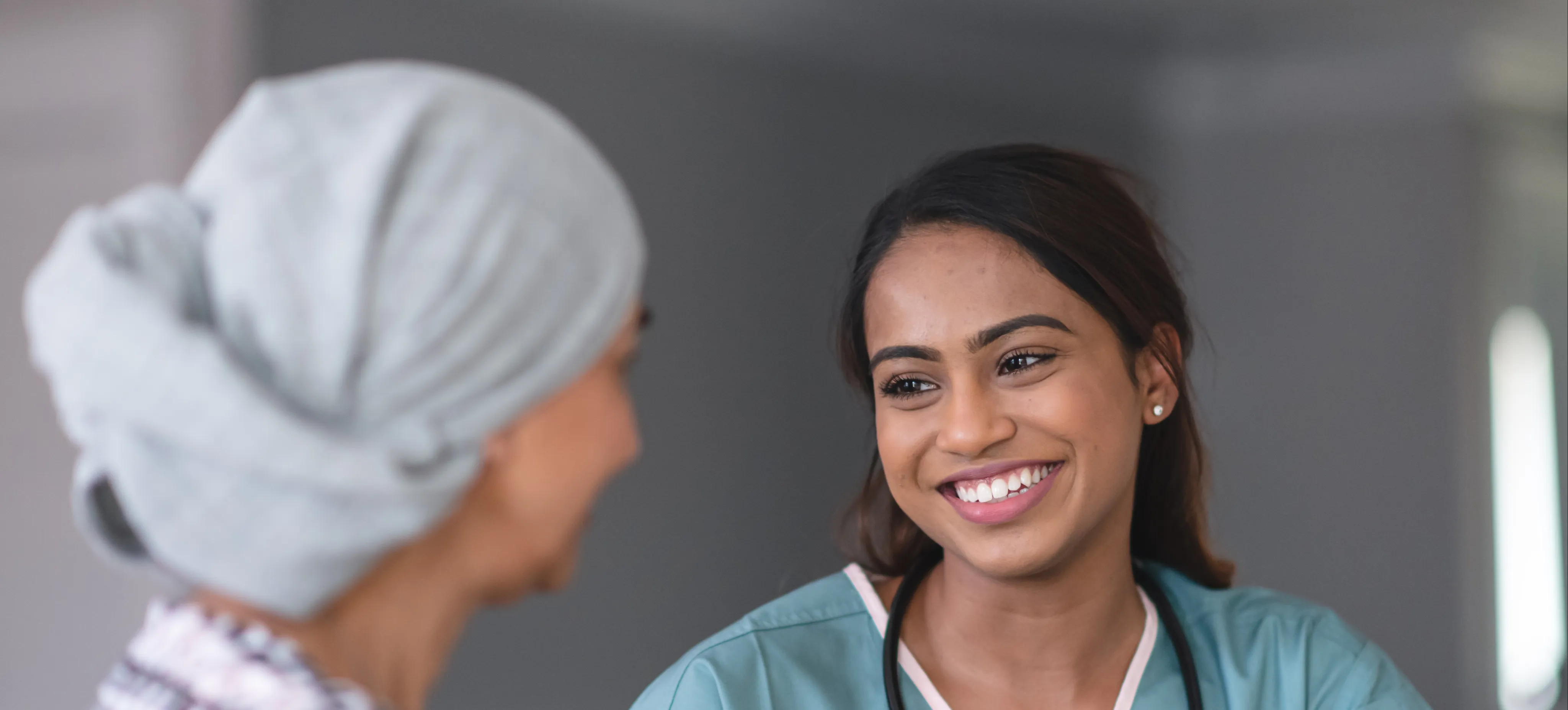 [Featured Image]:  An Advance Practice Registered Nurse,  one of the highest paying medical jobs, is consulting with a patient. 