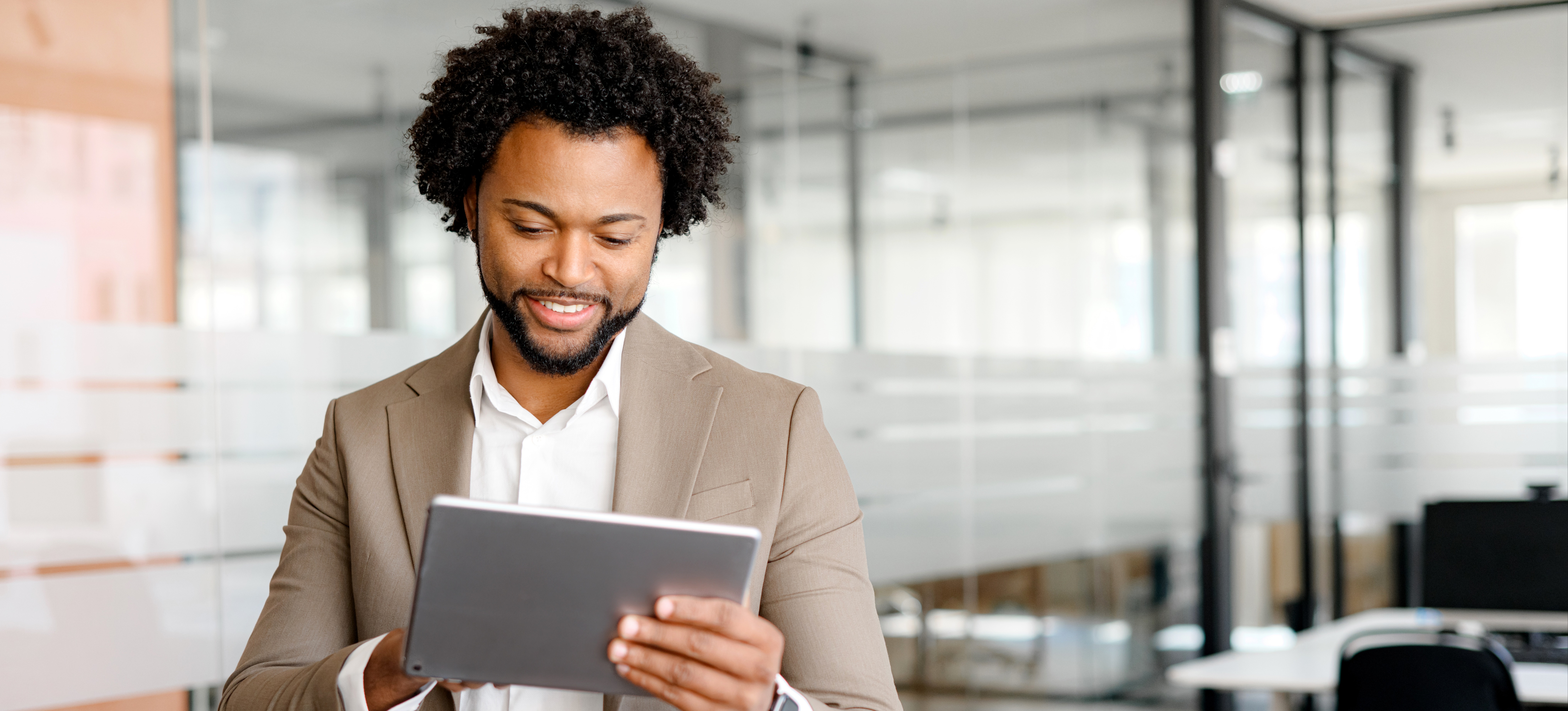 [Featured Image] An aspiring cybersecurity professional researches cybersecurity internship opportunities on a tablet while planning their next steps in their career journey. 
