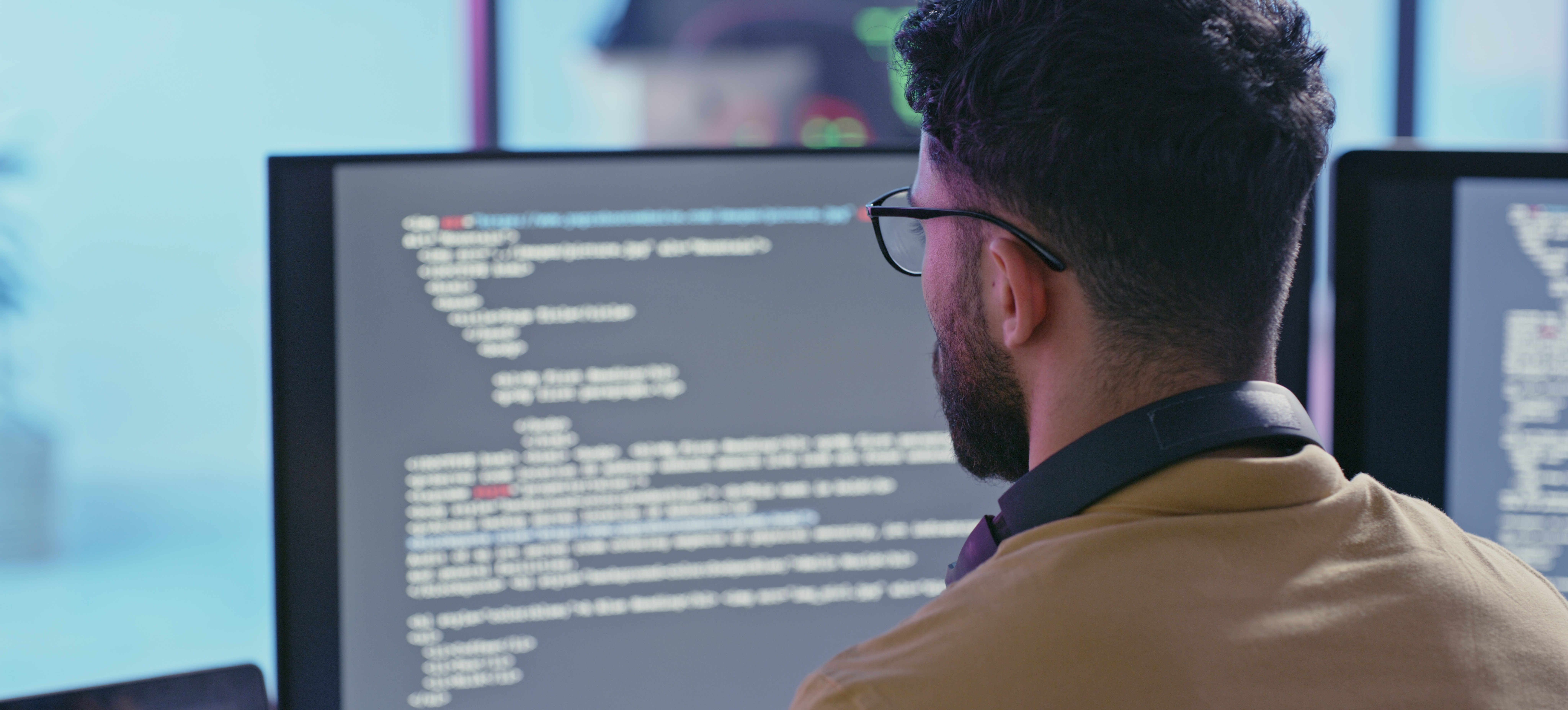[Featured Image] A software developer uses the Kotlin programming language to build an Android application.
