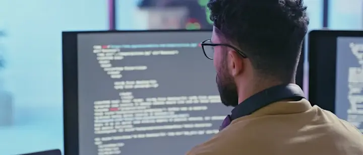 [Featured Image] A software developer uses the Kotlin programming language to build an Android application.
