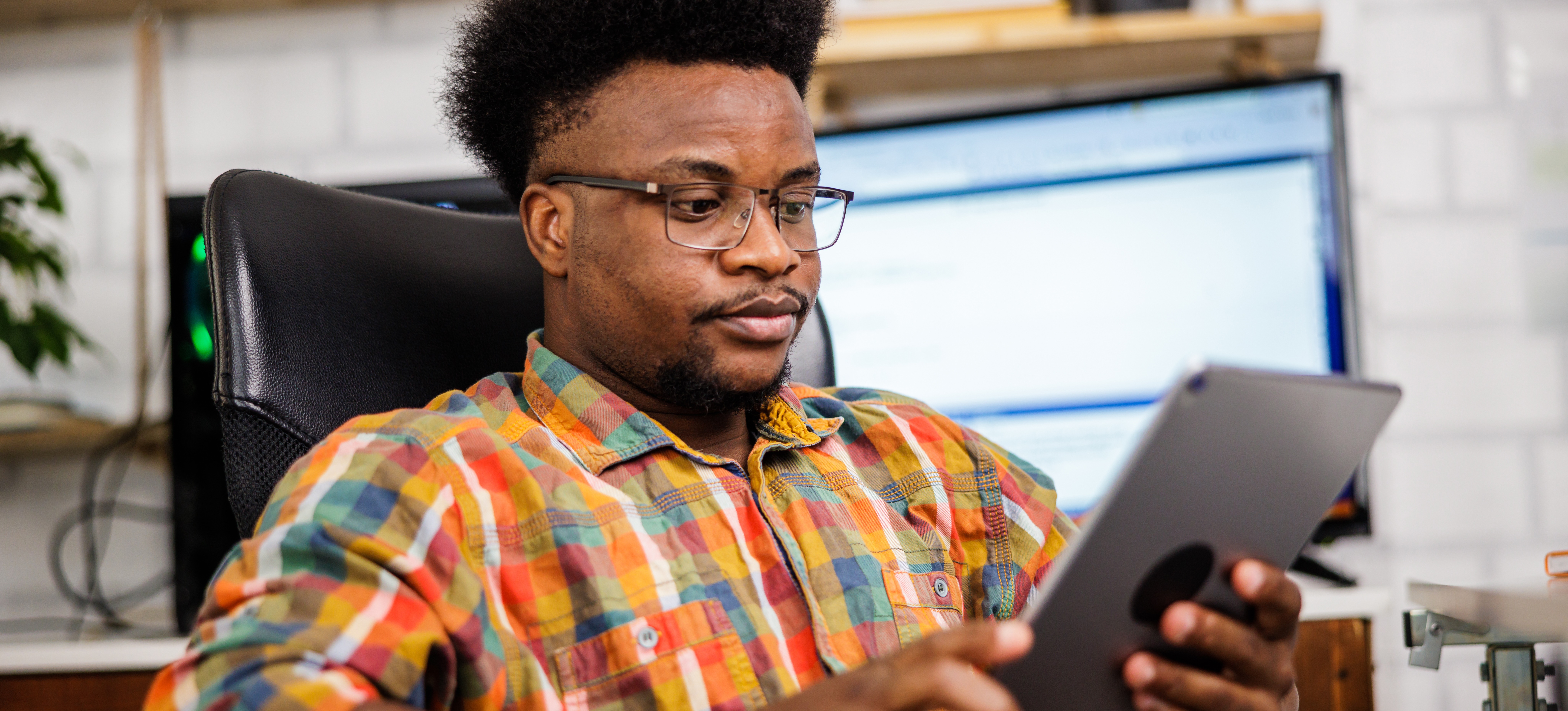 [Featured image] Junior AI engineer taking an online course to explore what is fine tuning, on a tablet.
