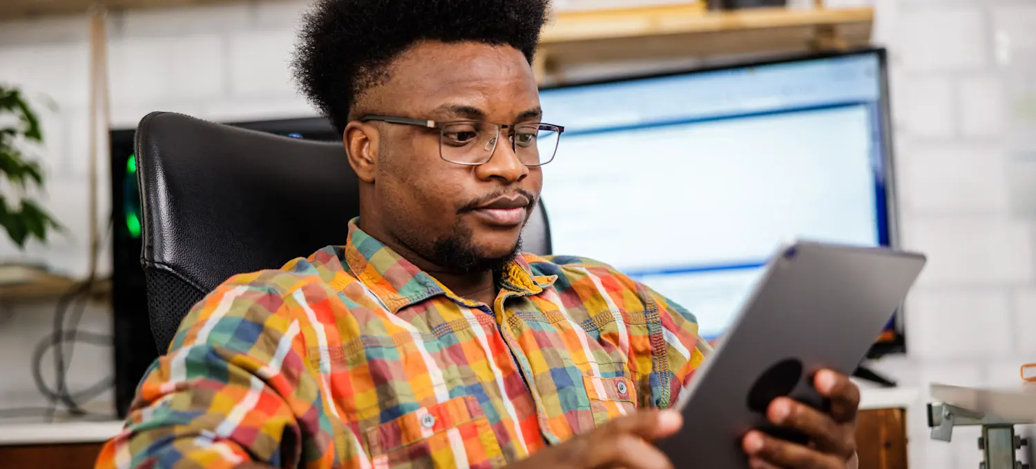 [Featured image] Junior AI engineer taking an online course to explore what is fine tuning, on a tablet.