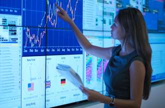 A student preparing a presentation on graphical screens.