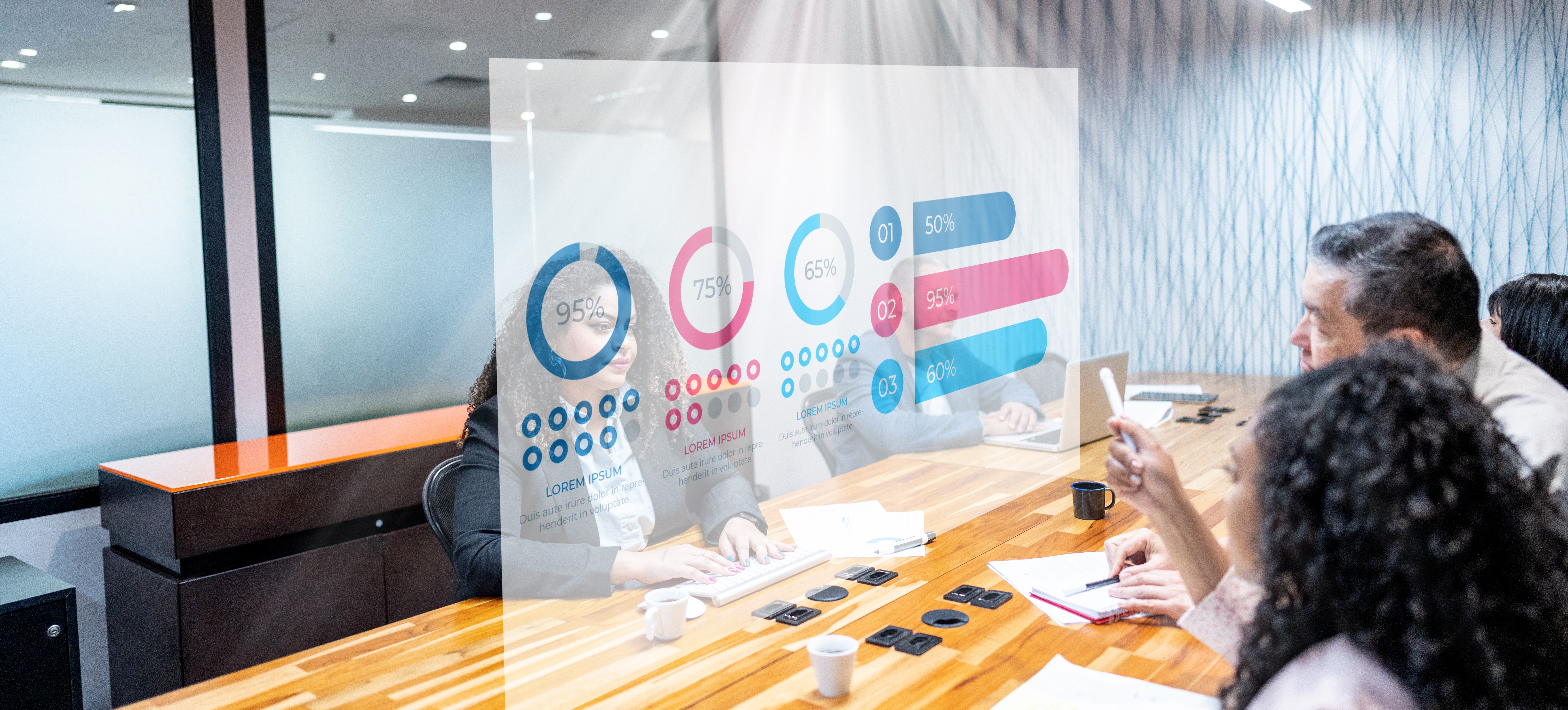 [Featured image] Coworkers are analysing data on holograms during a business meeting at the office.
