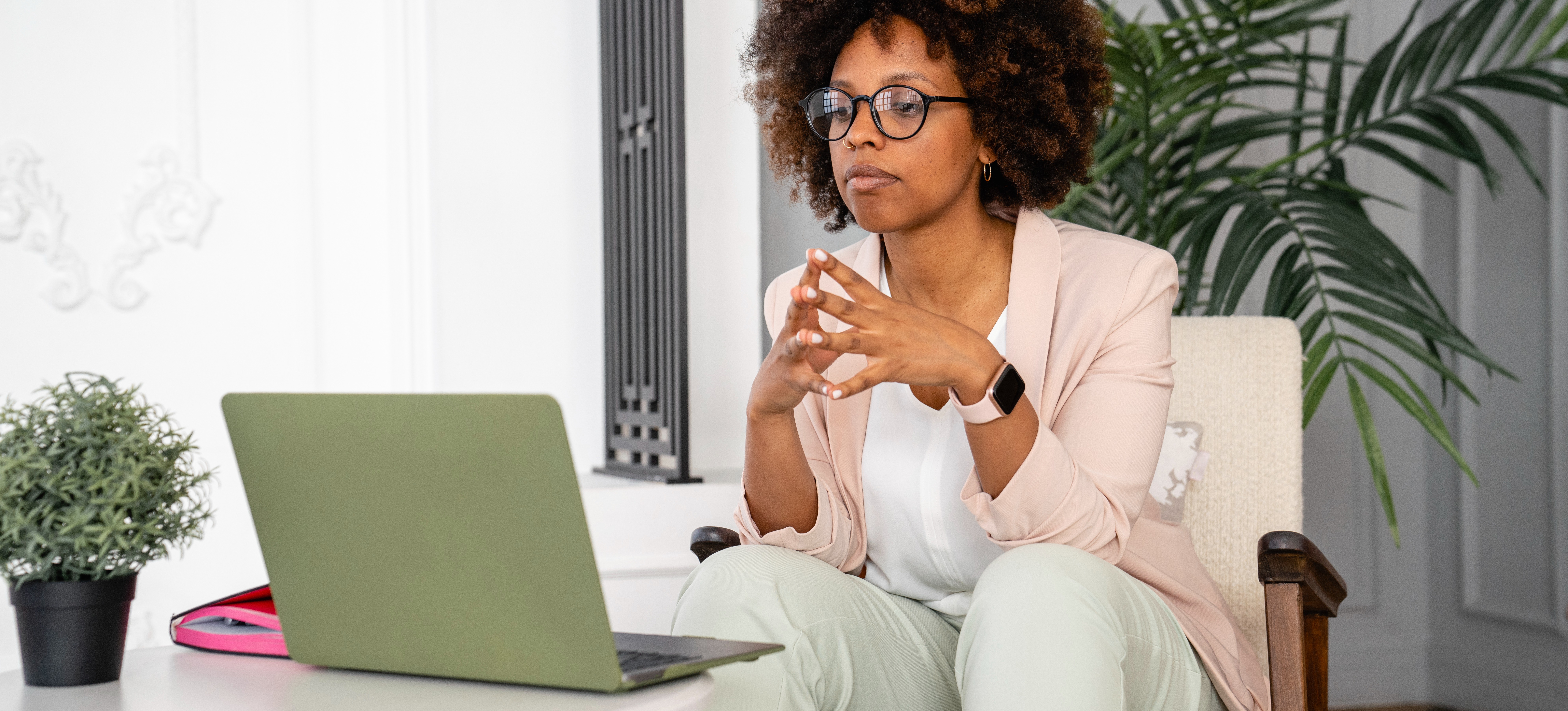 [Featured Image] A young professional meets virtually with a career counselor to gain additional direction in her job search.
