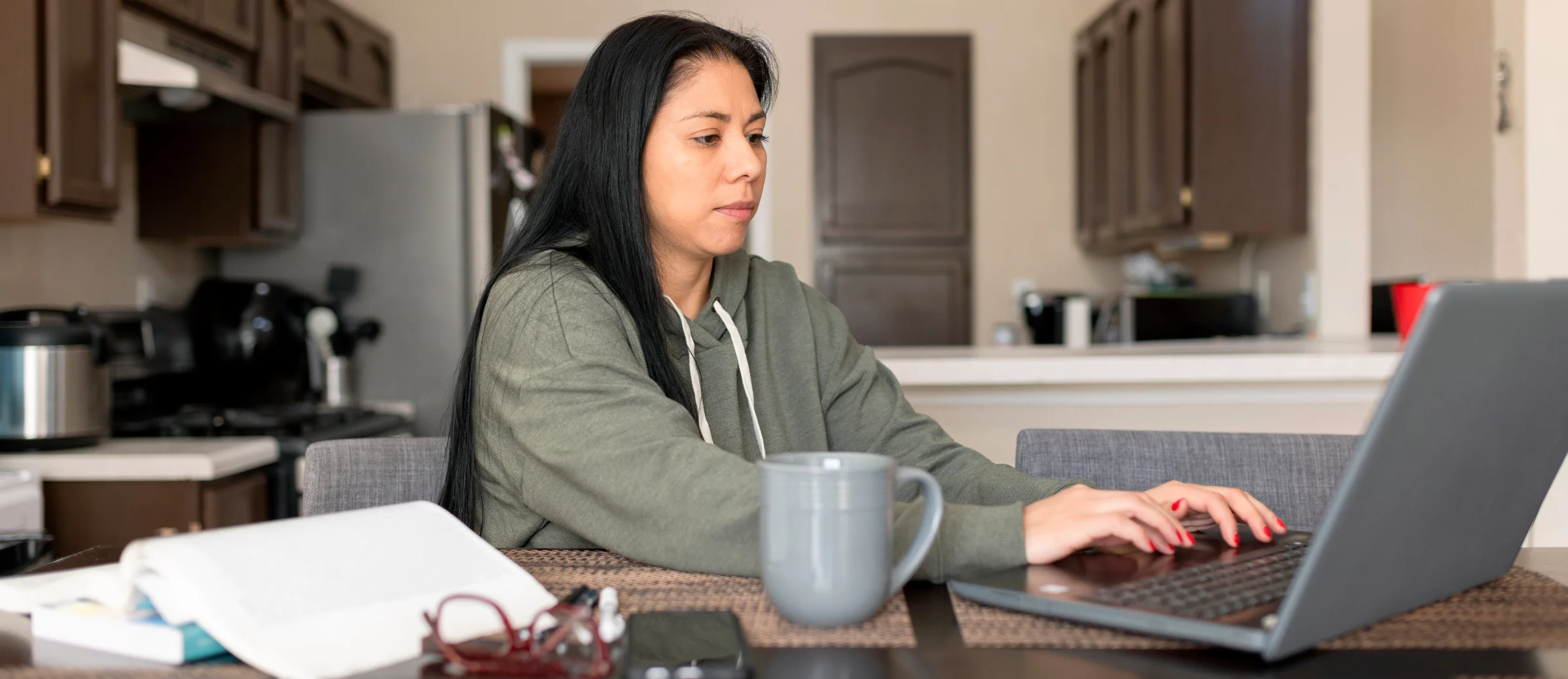 [Feature Image] A prospective learner researches the best platform to learn Python on their home computer as they plan their career and learning pathway.
