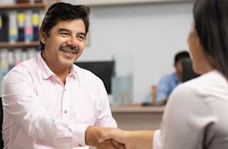 Two people shaking hands.