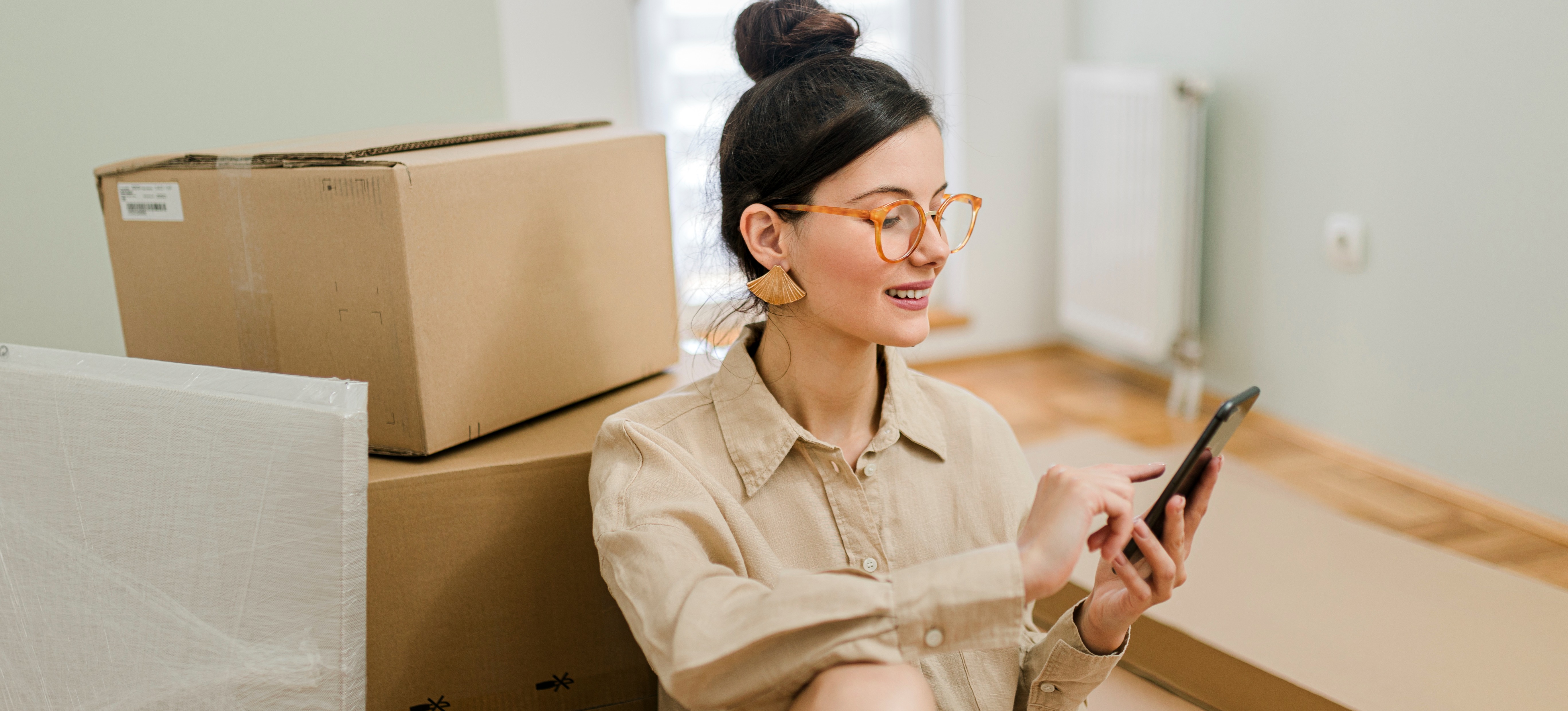 [Featured Image] A person packed to move closer to a job that will help them pay for grad school.
