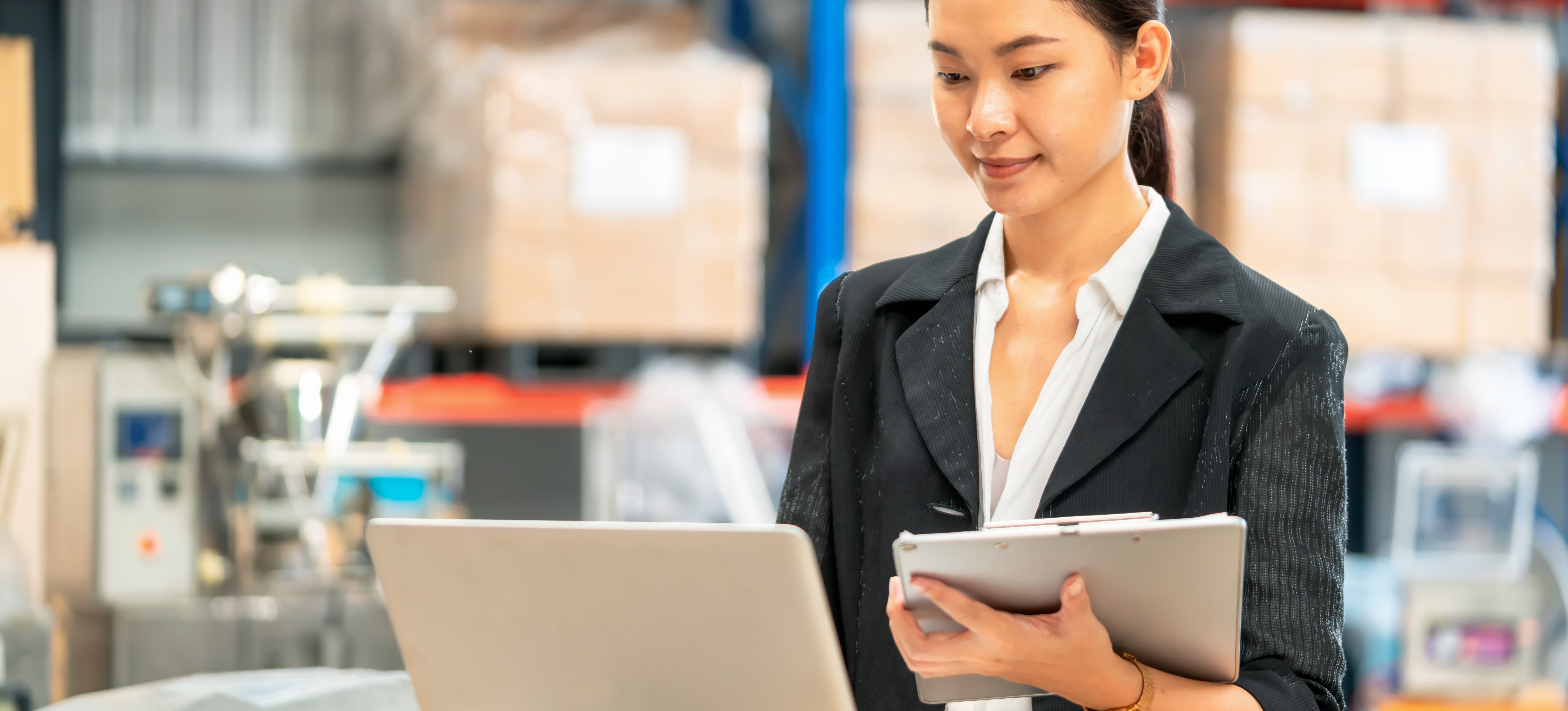 [Featured Image]: A technical product manager works on a laptop, helping to refine a product for their company.
