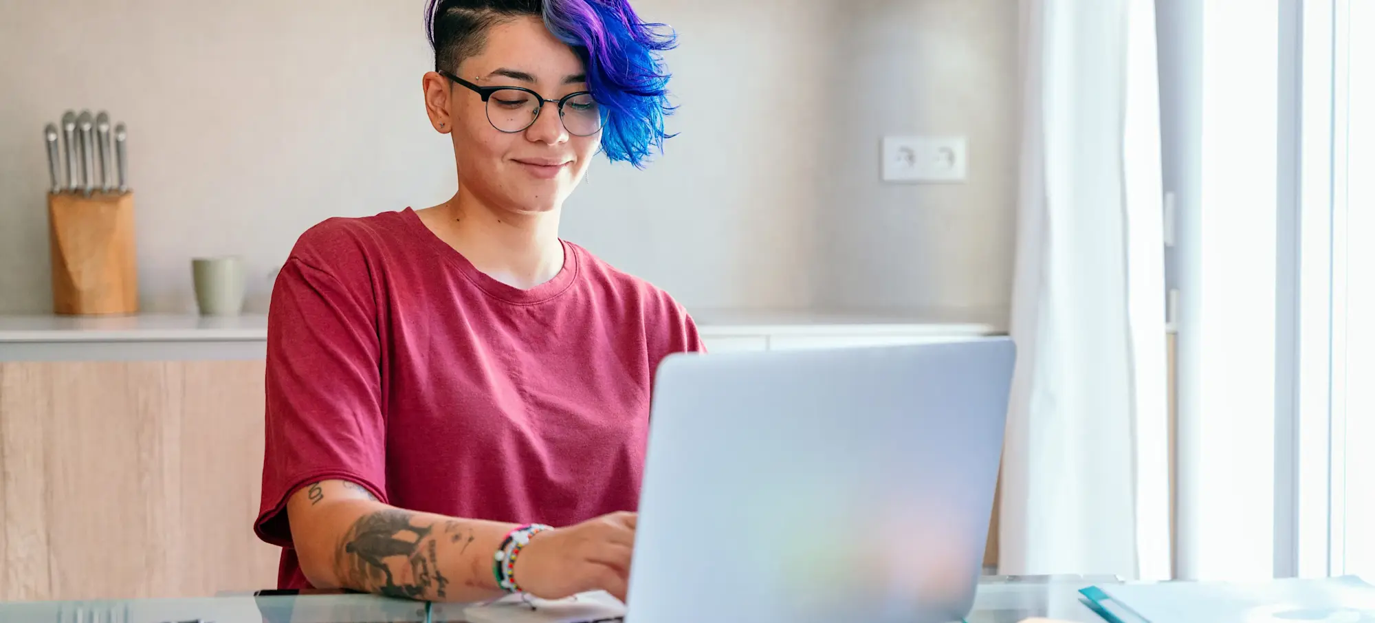 [Featured Image] A data scientist uses machine learning classification while working at their desk. 