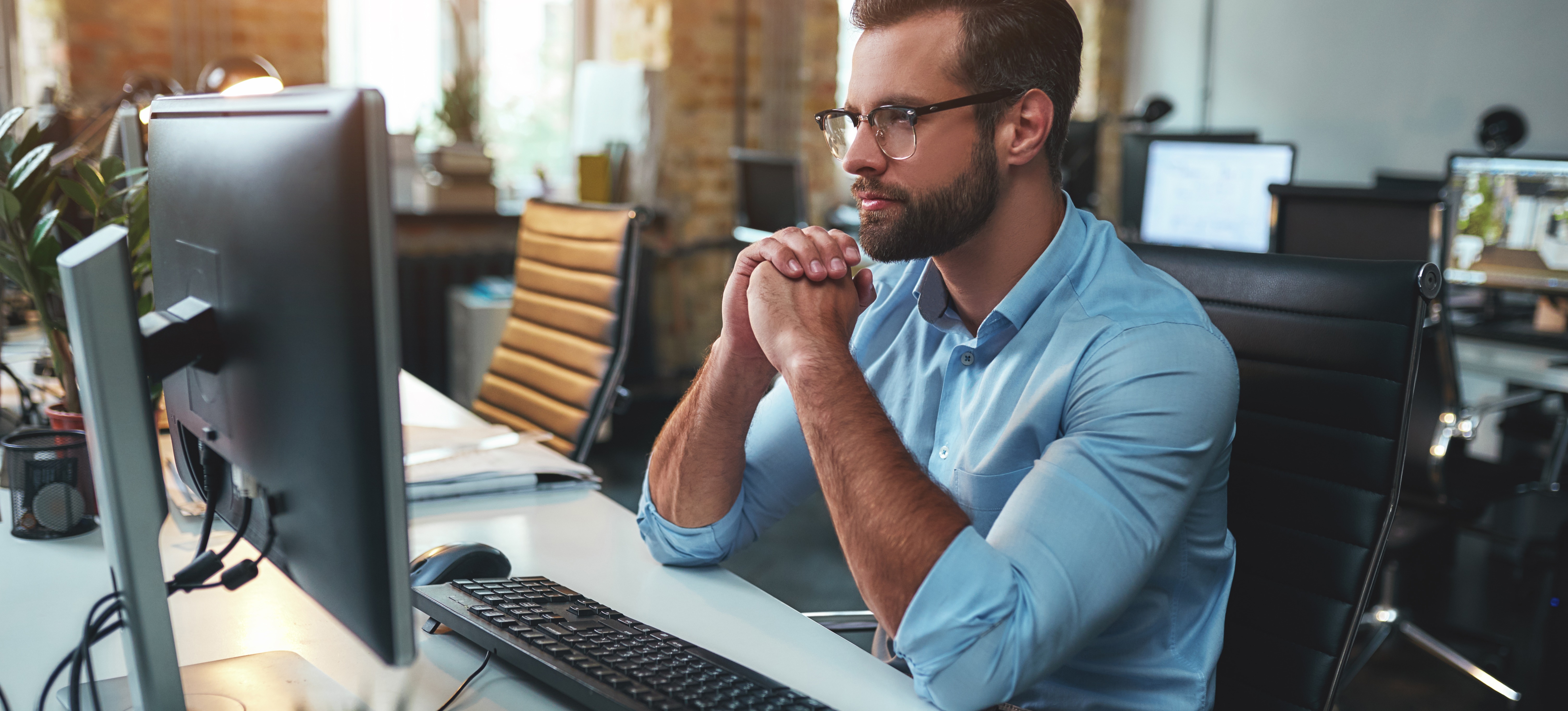 [Featured Image] A deep learning engineer ponders as they look at their computer screen.
