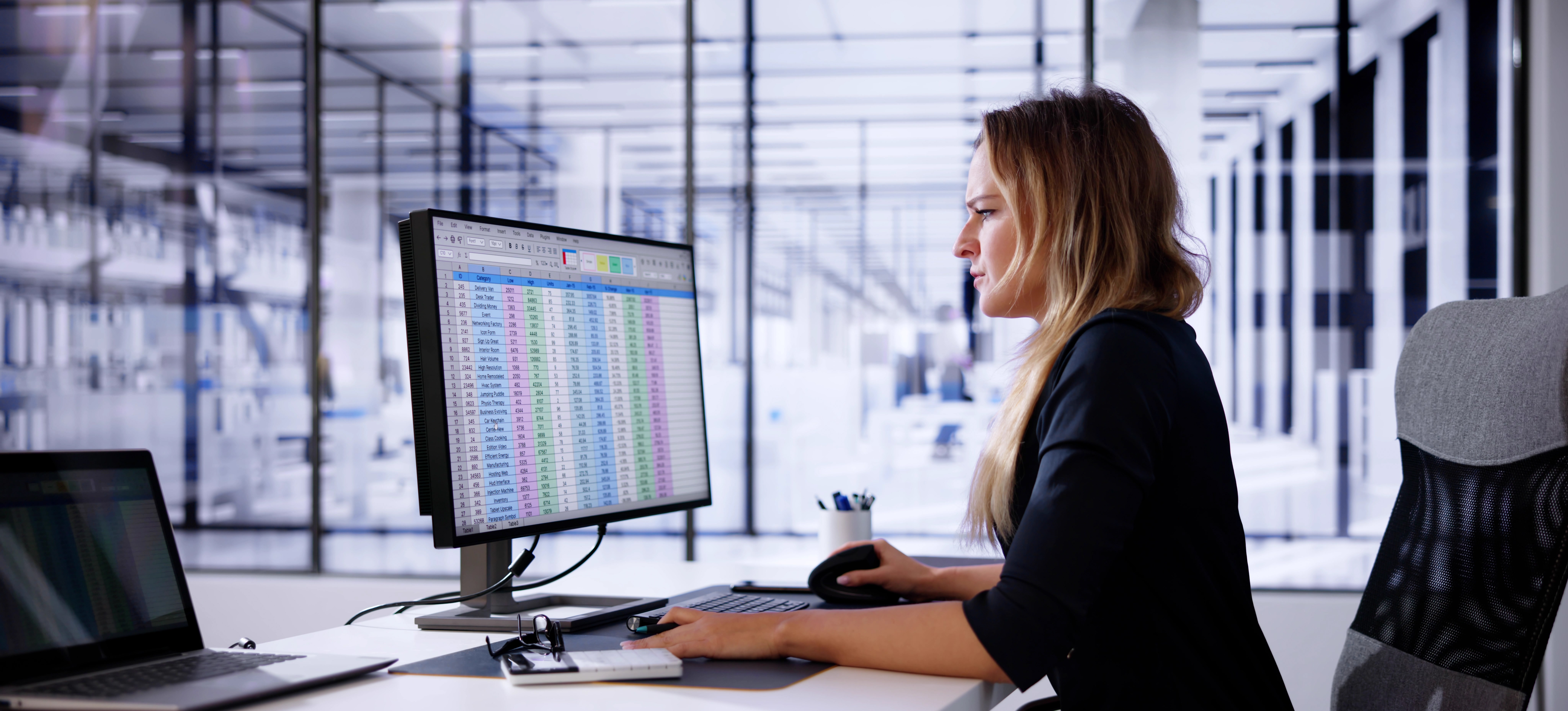 [Featured Image] A data analyst studies data organized by the REGEXMATCH function in Google Sheets while working on their computer in a well-lit office.